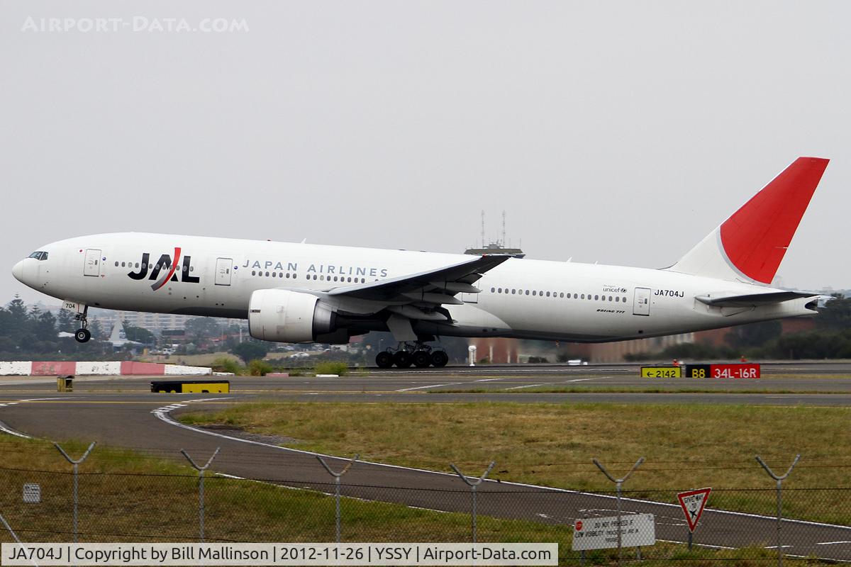 JA704J, 2003 Boeing 777-246/ER C/N 32892, off from 16R