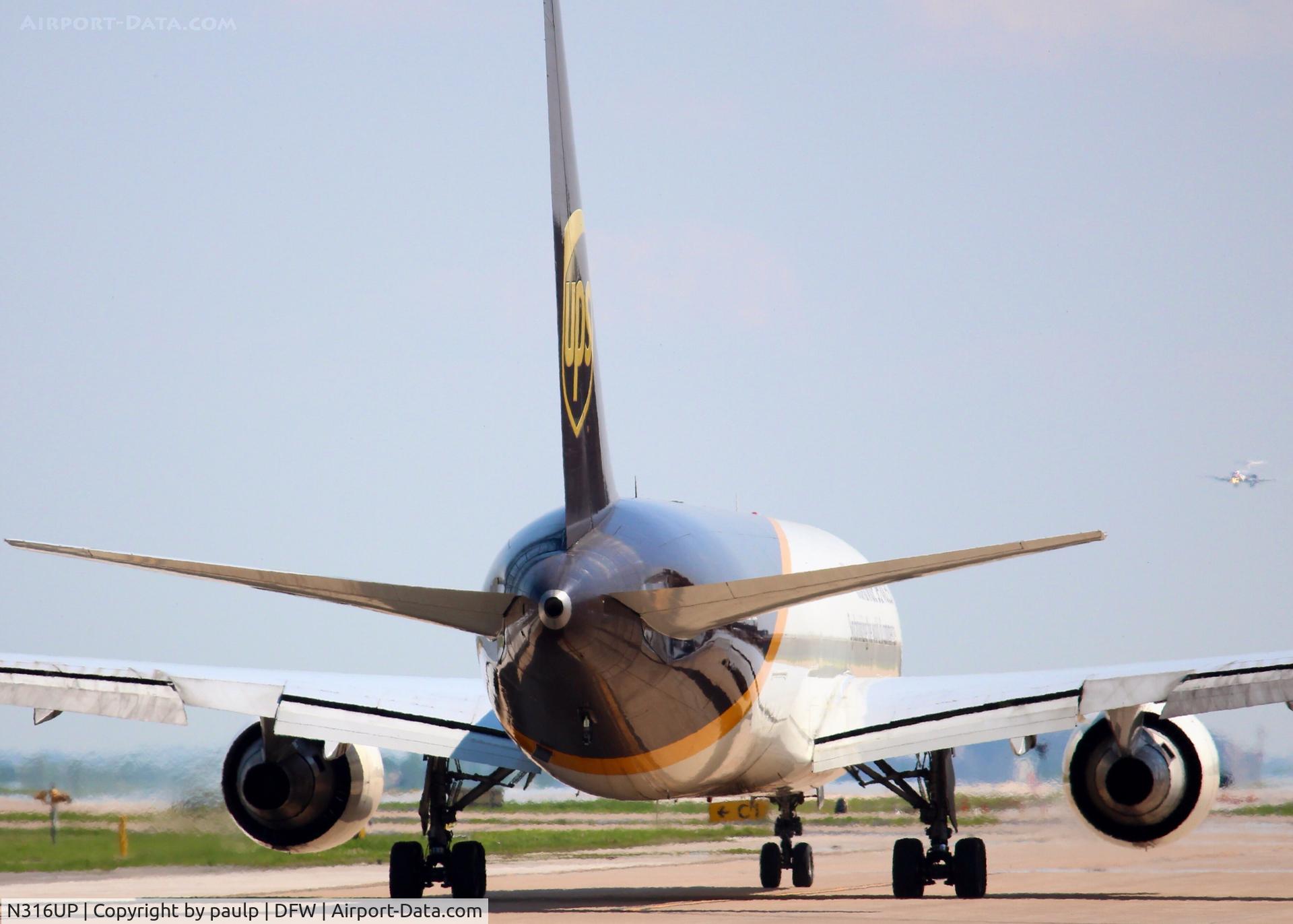 N316UP, 1997 Boeing 767-34AF C/N 27744, Taxiing to take off from the UPS ramp at DFW. The butt of a beautiful 767!