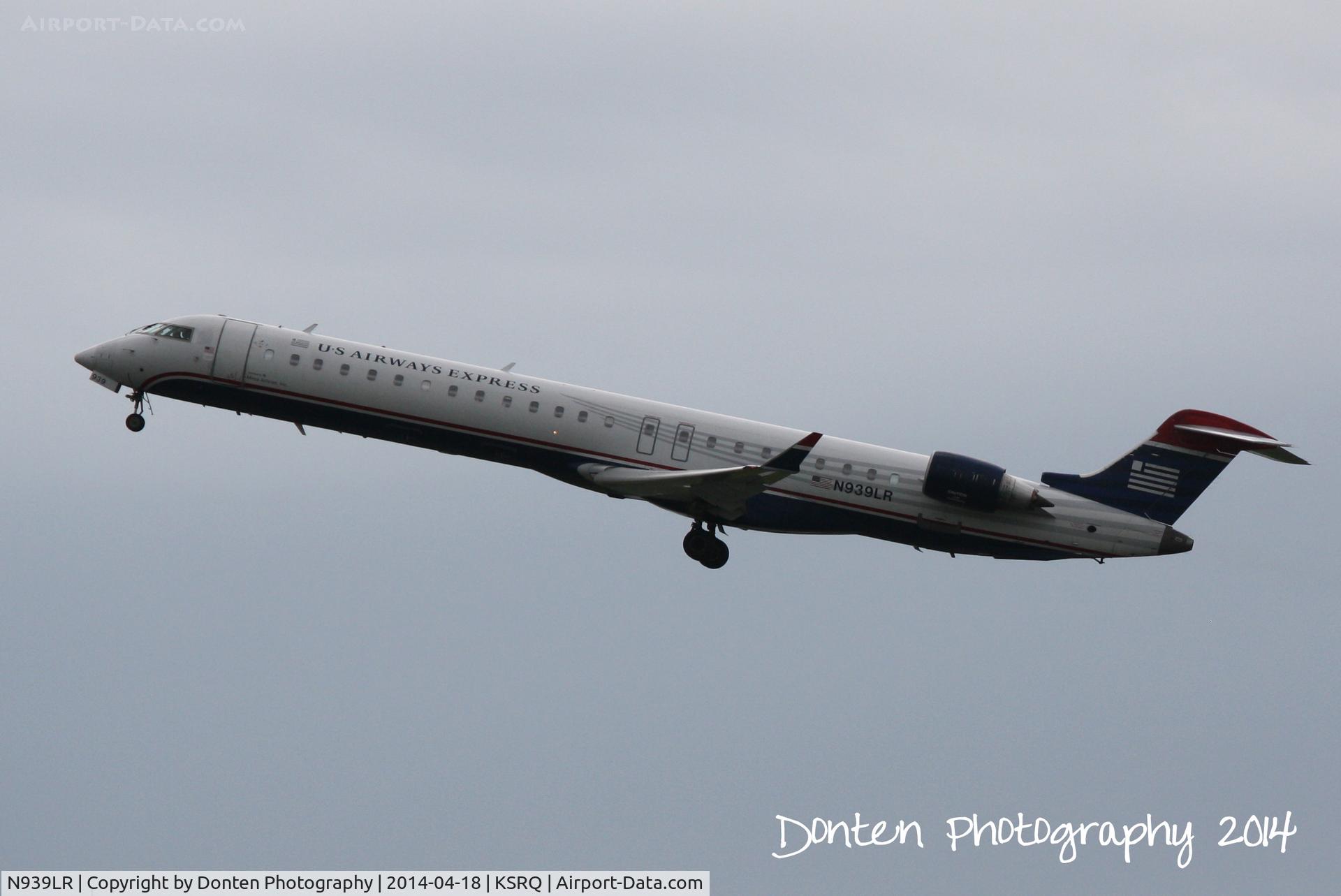 N939LR, 2005 Bombardier CRJ-900ER (CL-600-2D24) C/N 15039, US Air Flight 2805 operated by Mesa (N939LR) departs Sarasota-Bradenton International Airport enroute to Charlotte-Douglas International Airport