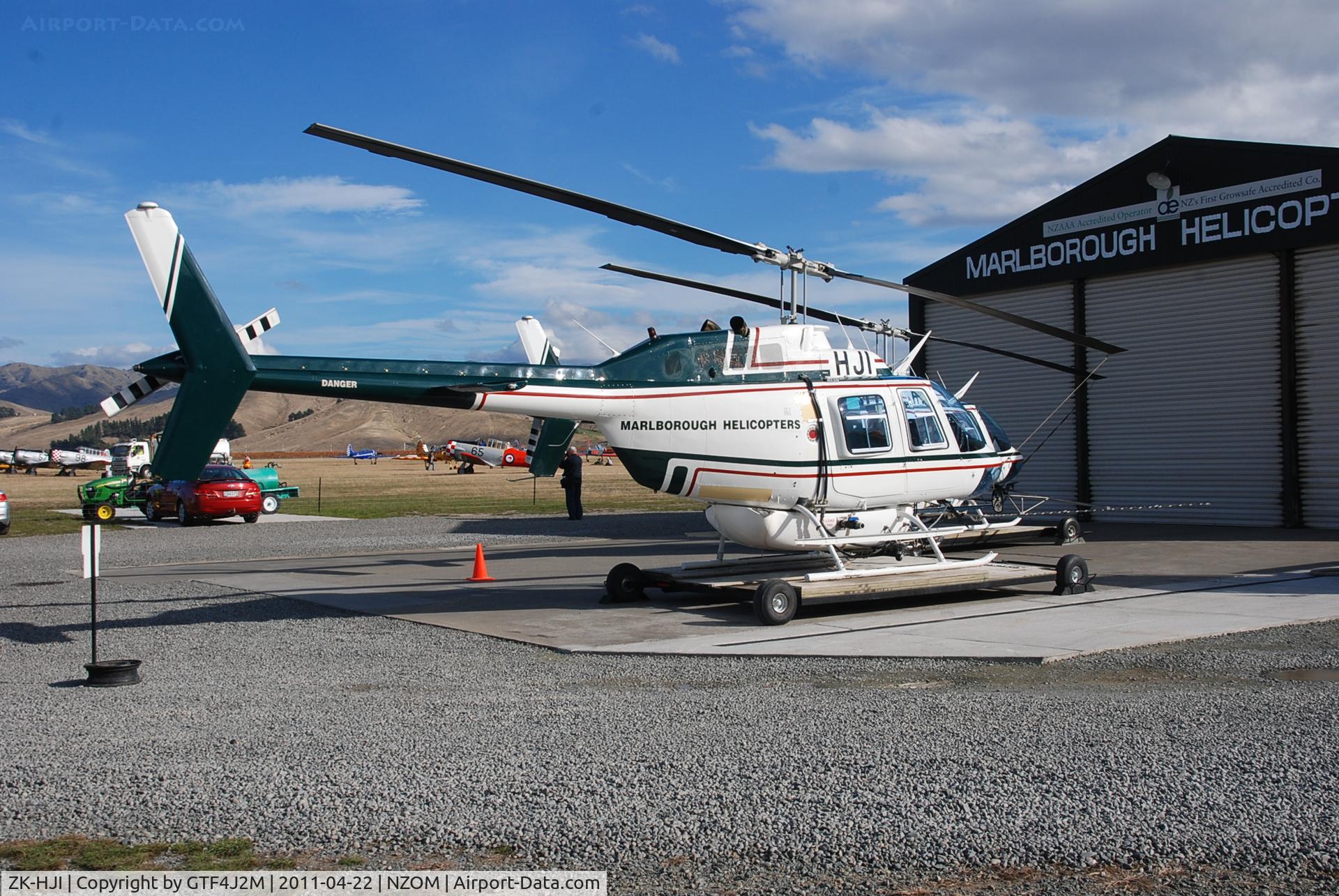 ZK-HJI, Bell 206B C/N 4083, ZK-HJI  Marlborough Helicopters outside their hangar at Omaka during the airshow 22.4.11