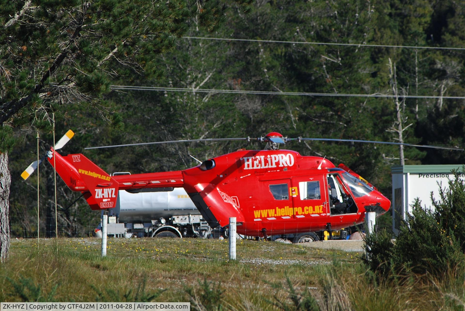 ZK-HYZ, MBB-Kawasaki BK-117A-3 C/N 1010, ZK-HYZ  of Helipro  on a helipad in an industrial estate at Kaiata, South Island 28.4.11