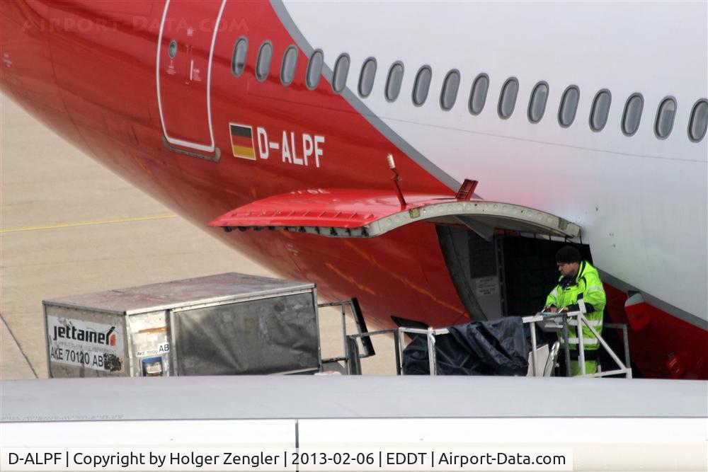D-ALPF, 2002 Airbus A330-223 C/N 476, Man at work conducting a ballet of containers.....