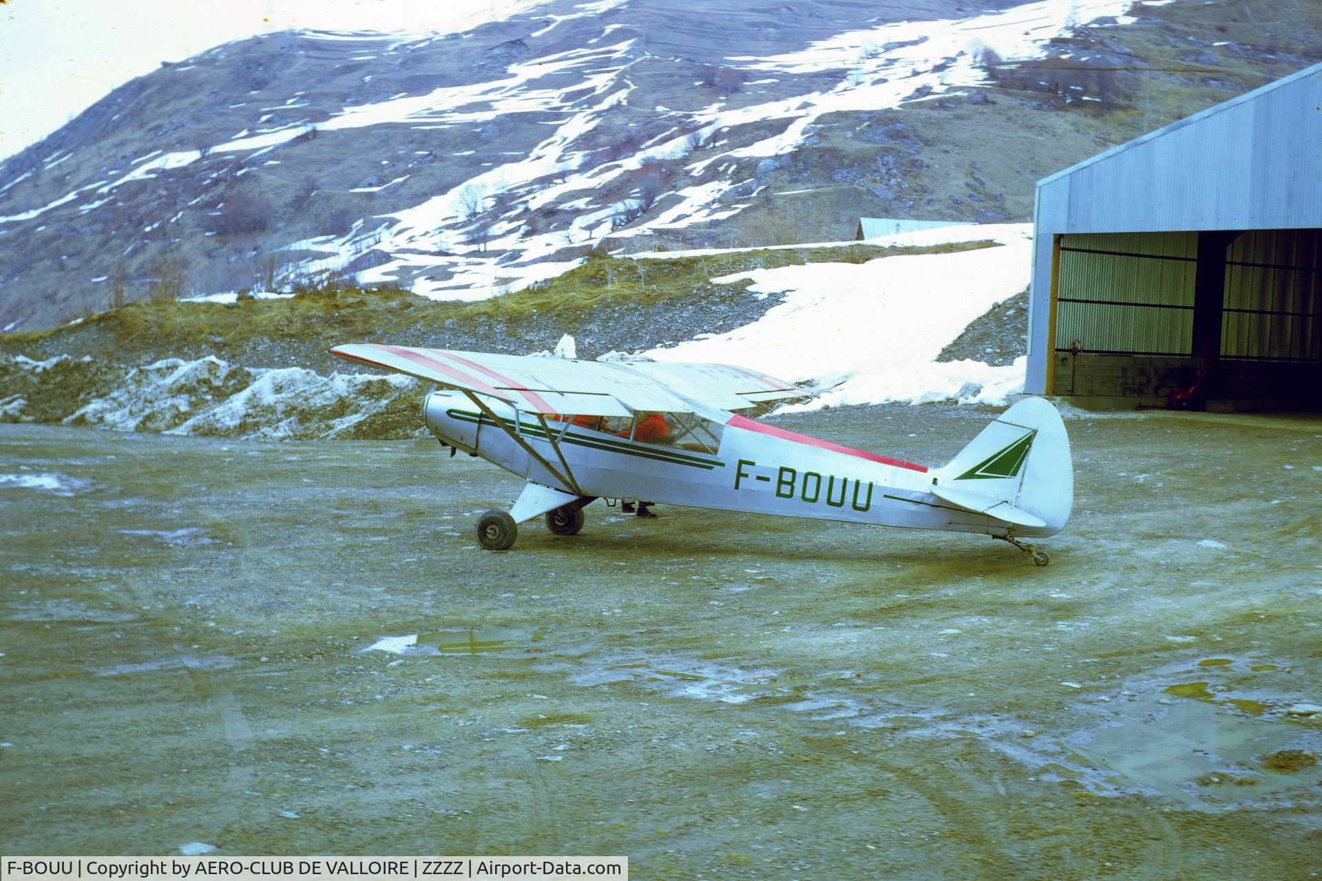 F-BOUU, 1951 Piper L-18C Super Cub (PA-18-95) C/N 18-1551, Valloire-Bonnenuit, Savoy/France, spring 1974, now a hangar had been constructed. Scanned Kodachrome slide.