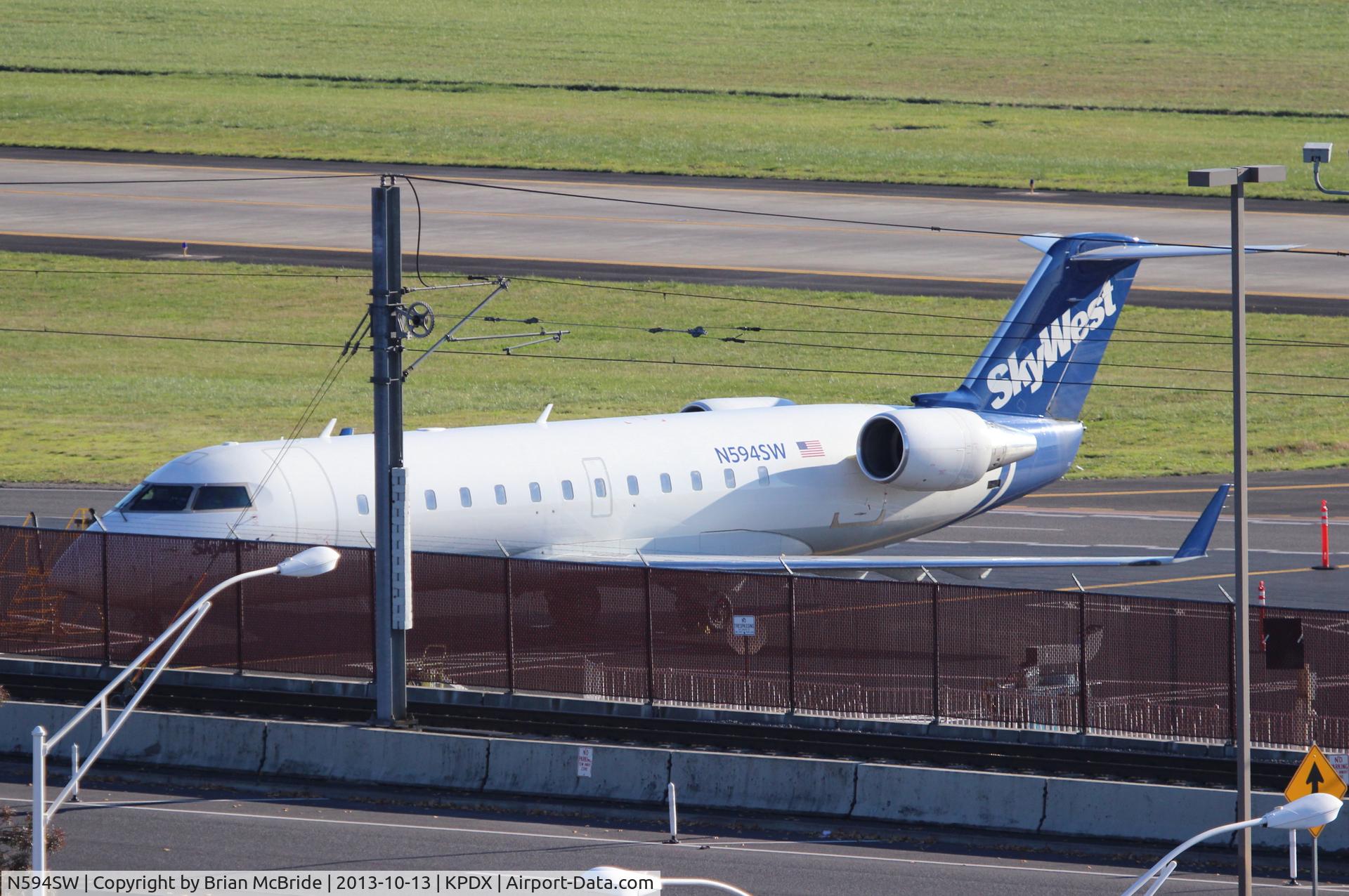 N594SW, 1999 Bombardier CRJ-100ER (CL-600-2B19) C/N 7285, SkyWest Airlines. Canadair CL-600-2B19 Regional Jet CRJ-100ER. N594SW cn 7285.Portland - International (PDX KPDX). Image © Brian McBride. 22 October 2013