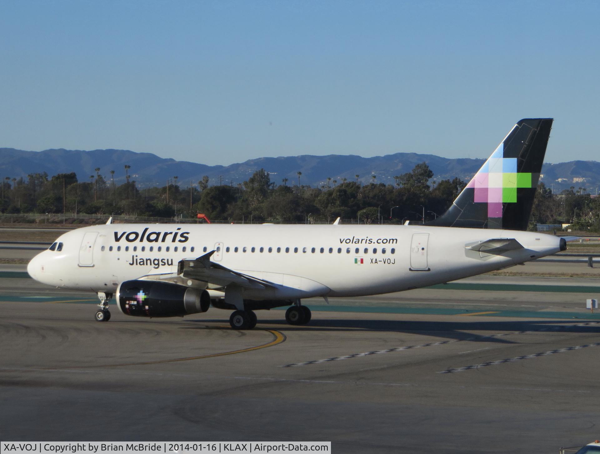 XA-VOJ, 2007 Airbus A319-133 C/N 3279, volaris. A319-123. XA-VOJ cn 3279. Jiangsu. Los Angeles - International (LAX KLAX). Image © Brian McBride. 16 January 2014