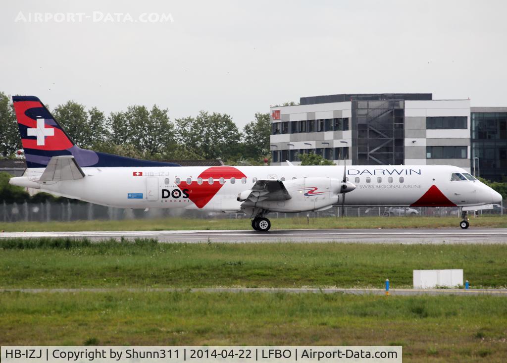 HB-IZJ, 1995 Saab 2000 C/N 2000-015, Lining up rwy 32R for departure with additional 'DOS Group' special livery...