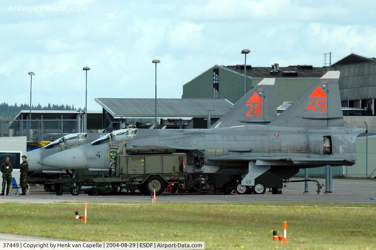 37449, 1990 Saab JA 37Di Viggen C/N 37449, Two Saab JA37DI Viggen fighters of the Swedish Air Force parked at Ronneby Air Base, 2004.