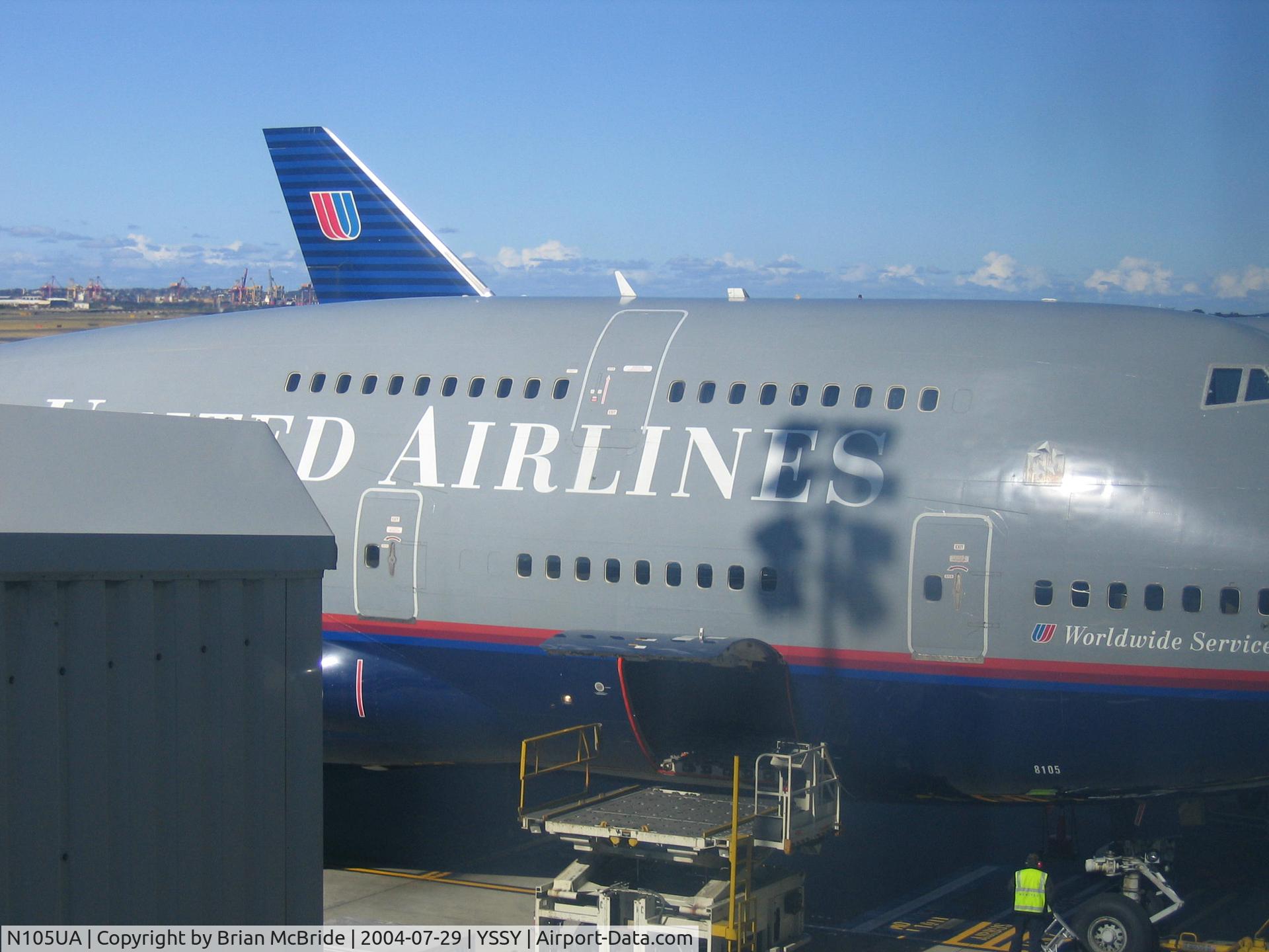 N105UA, 1994 Boeing 747-451 C/N 26473, United Airlines. 747-451. N105UA 8105 cn 26473 985. Tail of Sister 744 Ship N128UA behind her. Sydney - Kingsford Smith International (Mascot) (SYD YSSY). Image © Brian McBride. 29 July 2004