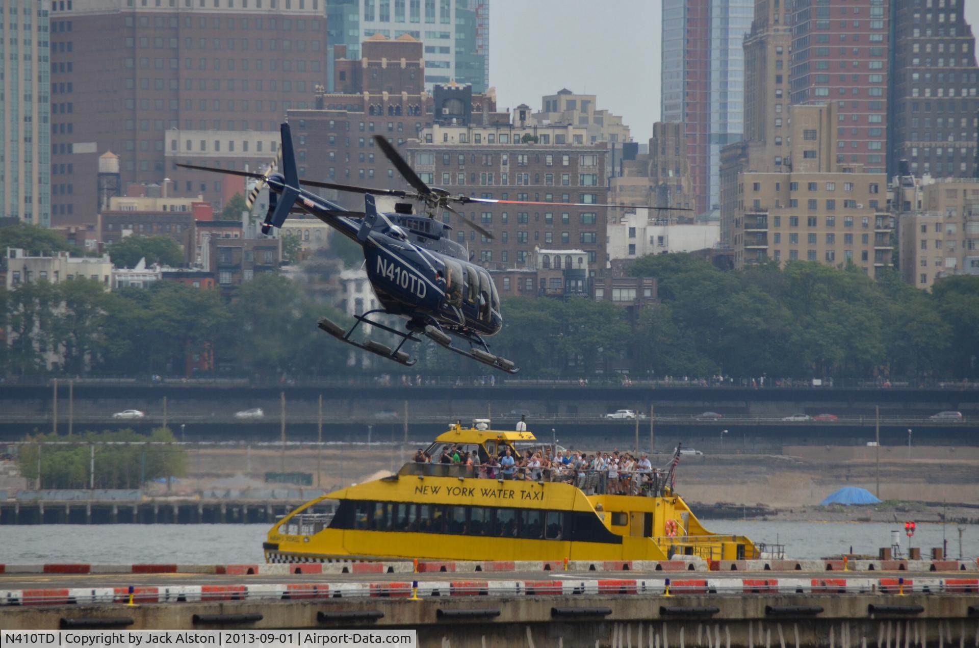 N410TD, 2012 Bell 407GX C/N 54306, Taking off for Manhattan tour.