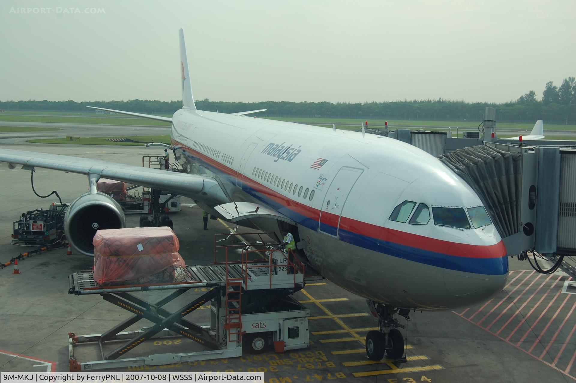 9M-MKJ, 1995 Airbus A330-322 C/N 119, Malaysian A333 at its gate in SIN.