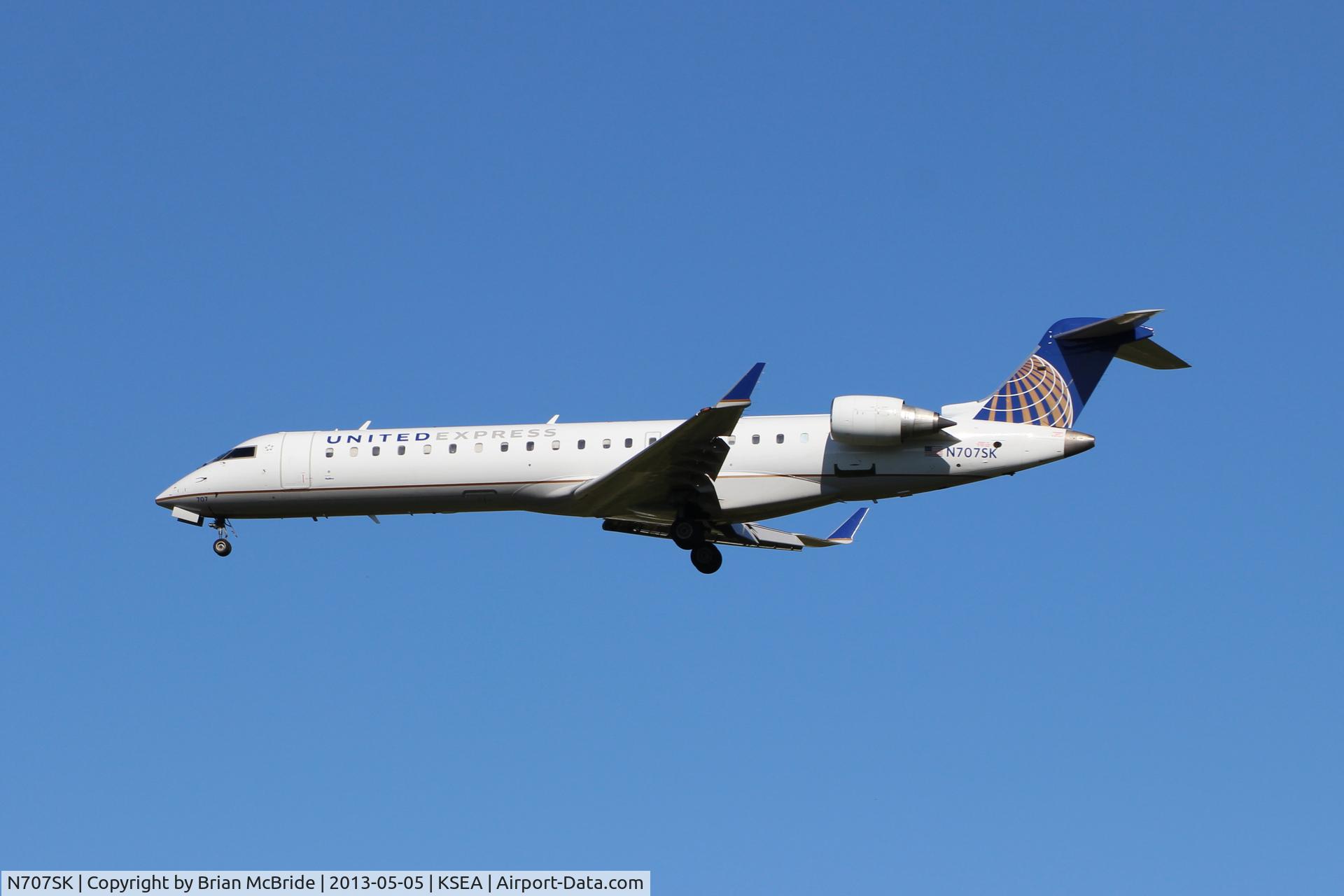 N707SK, 1999 Bombardier CRJ-701ER (CL-600-2C10) Regional Jet C/N 10003, United Express (SkyWest Airlines). Canadair CL-600-2C10 Regional Jet CRJ-700. N707SK cn 10003. Seattle Tacoma - International (SEA KSEA). Image © Brian McBride. 05 May 2013