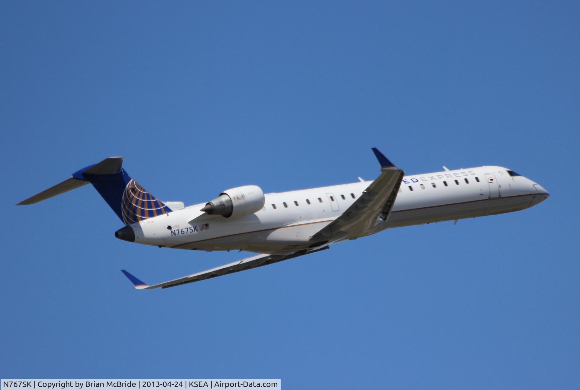 N767SK, 2005 Bombardier CRJ-702 (CL-600-2C10) Regional Jet C/N 10233, United Express (SkyWest Airlines). Canadair CL-600-2C10 Regional Jet CRJ-700. N767SK cn 10233. Seattle Tacoma - International (SEA KSEA). Image © Brian McBride. 24 April 2013