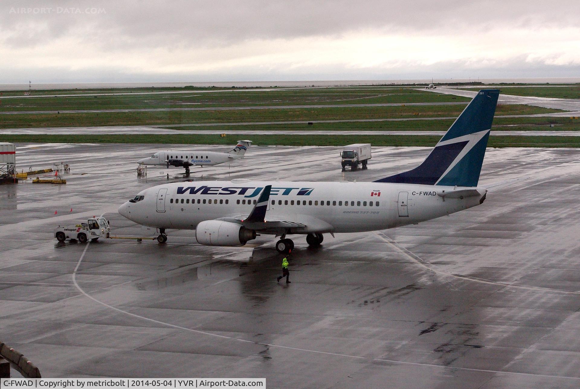 C-FWAD, 2002 Boeing 737-7CT C/N 32753, Rainy day departure