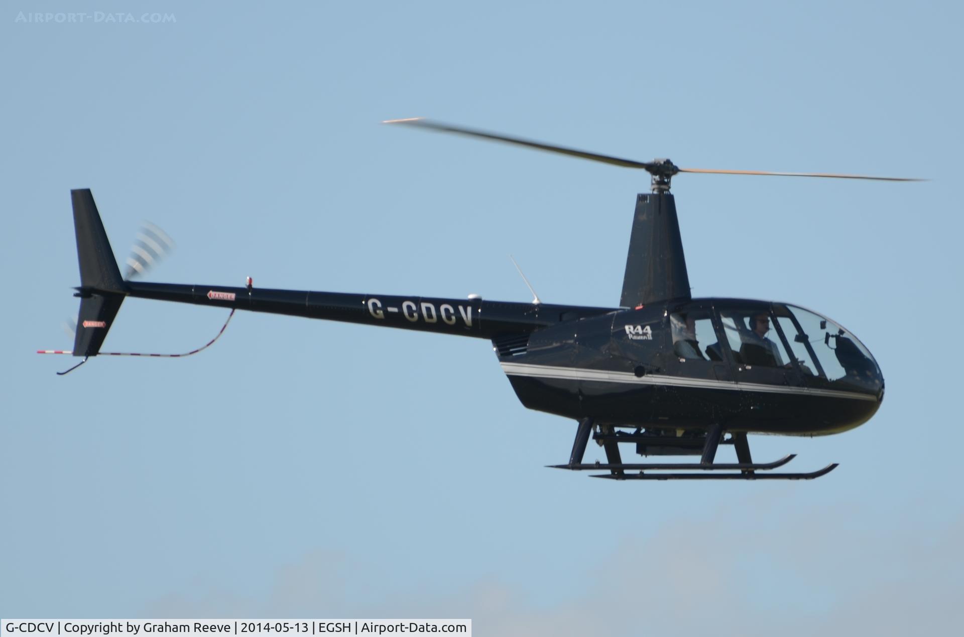 G-CDCV, 2004 Robinson R44 Raven II C/N 10536, About to touch down at Norwich.