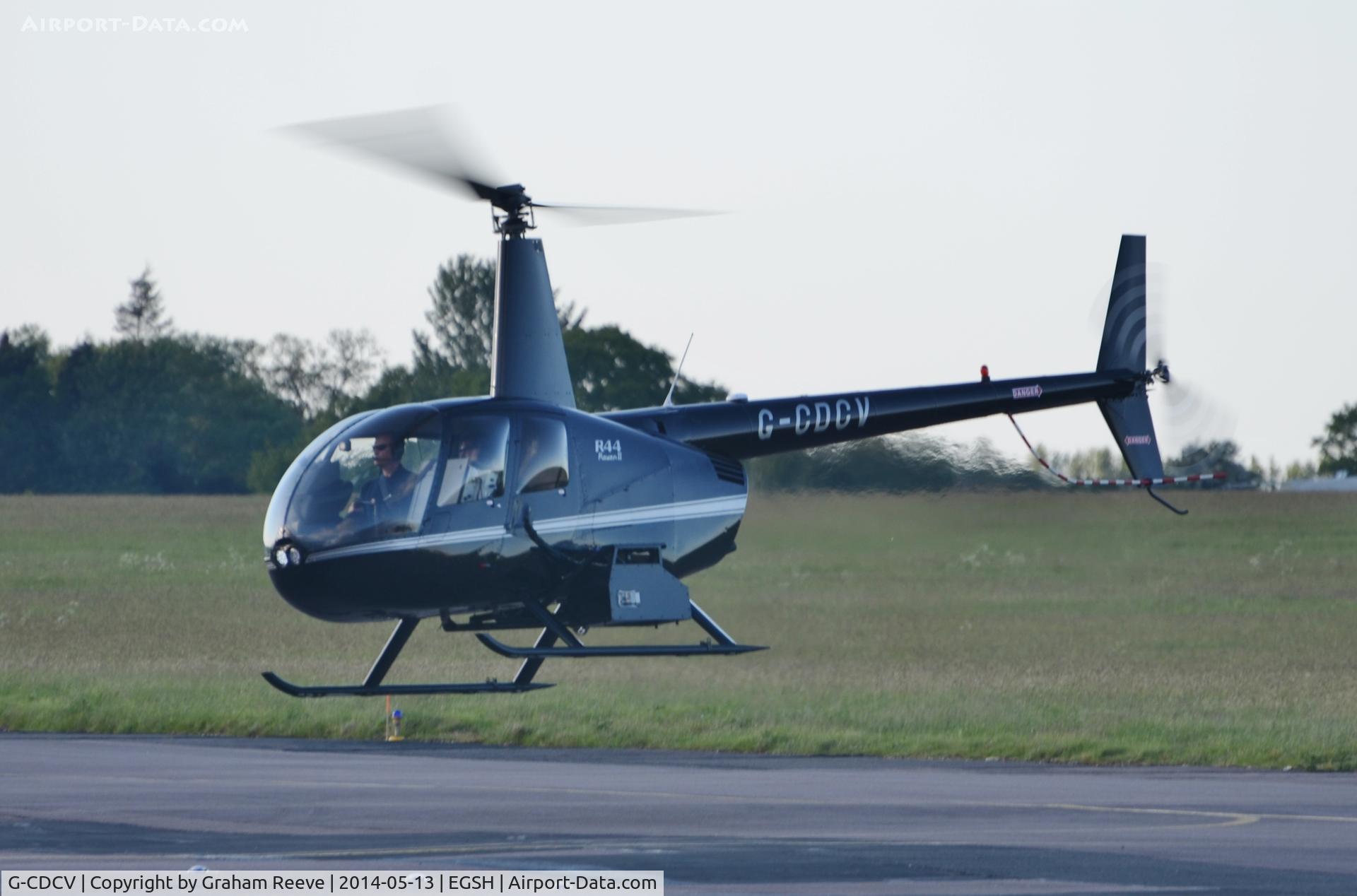 G-CDCV, 2004 Robinson R44 Raven II C/N 10536, About to touch down.