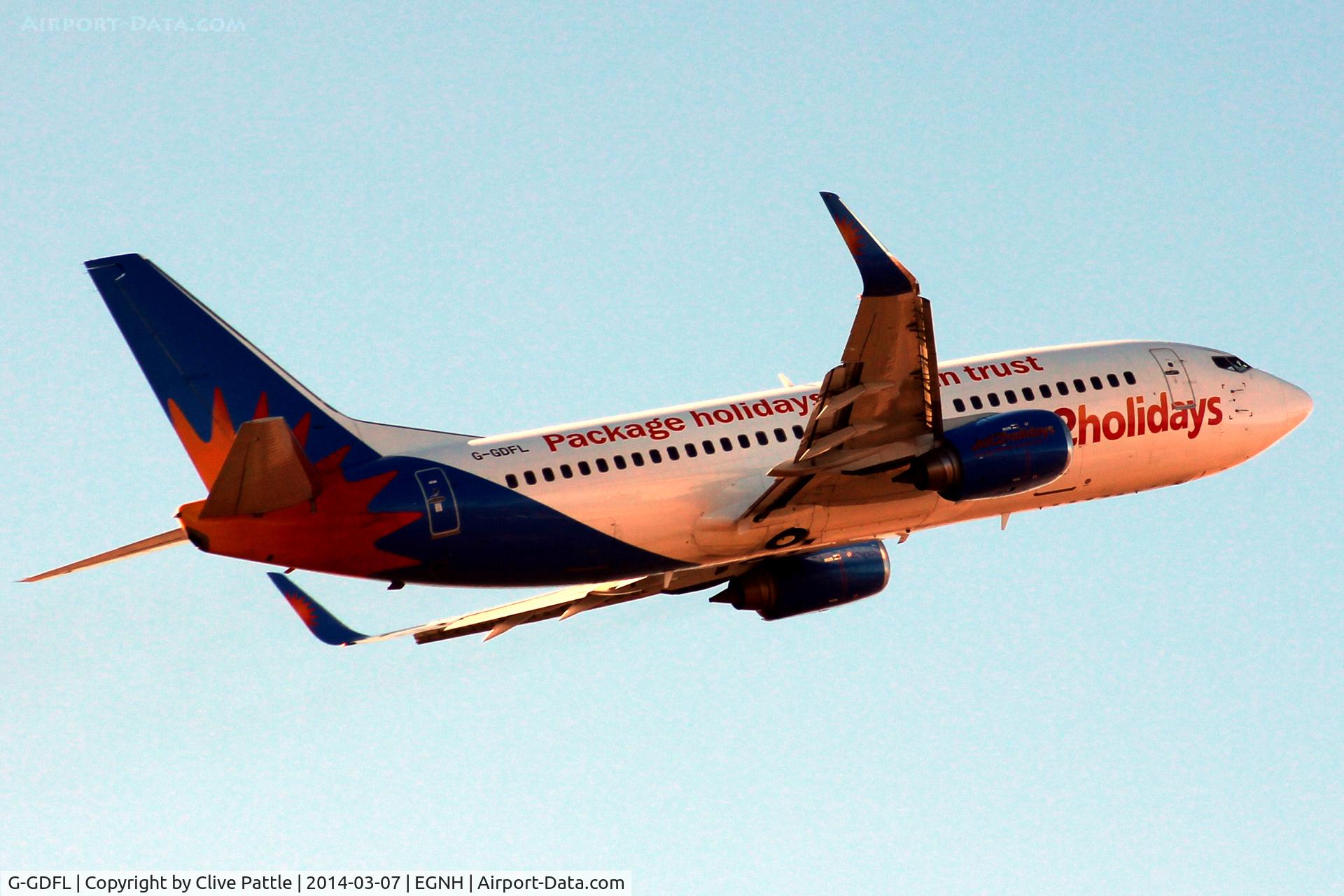 G-GDFL, 1998 Boeing 737-36N C/N 28568, Take off for Tenerife South with the setting sun lighting up the scene.