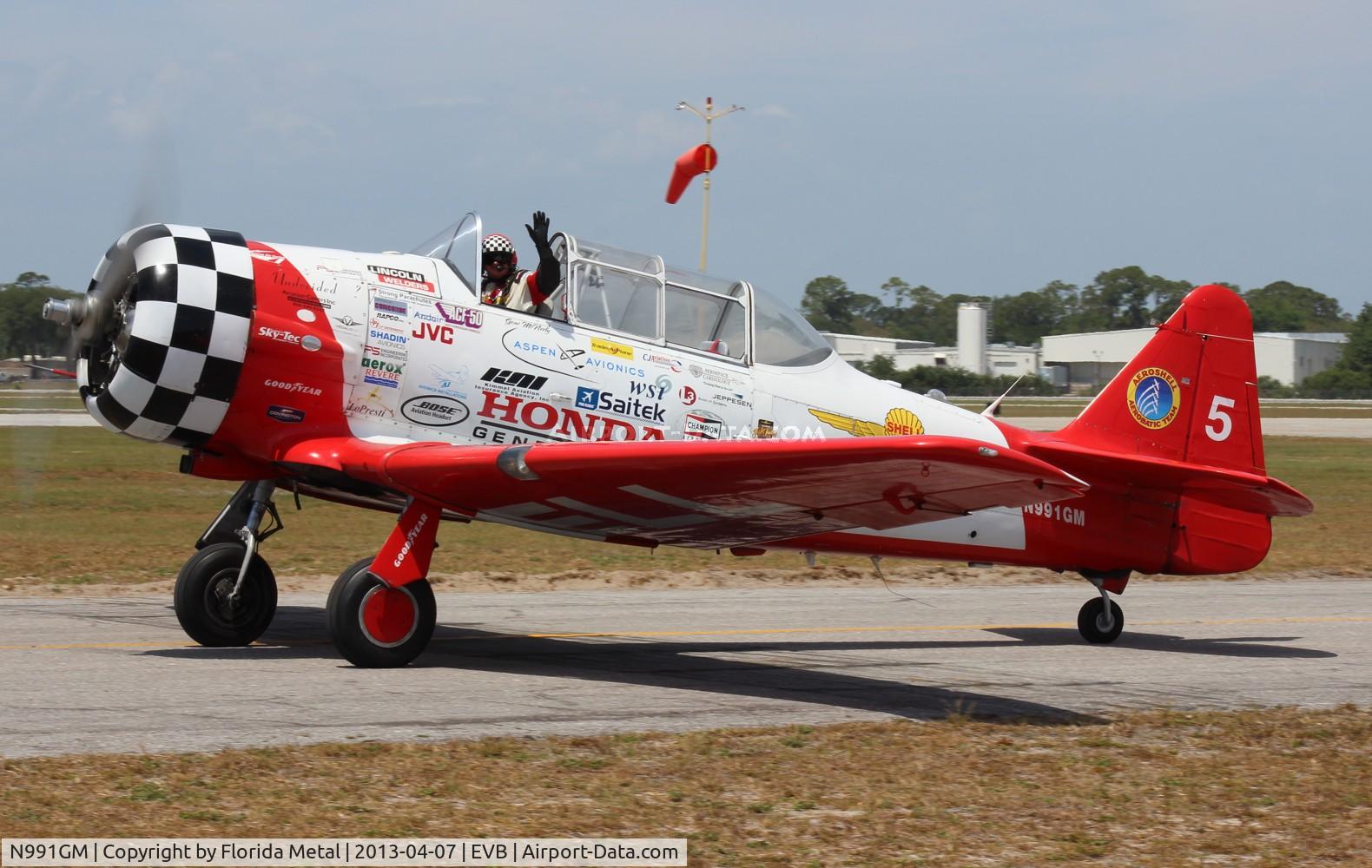 N991GM, 1941 North American AT-6C Texan C/N 88-17575, Gene McNeeley with Aeroshell