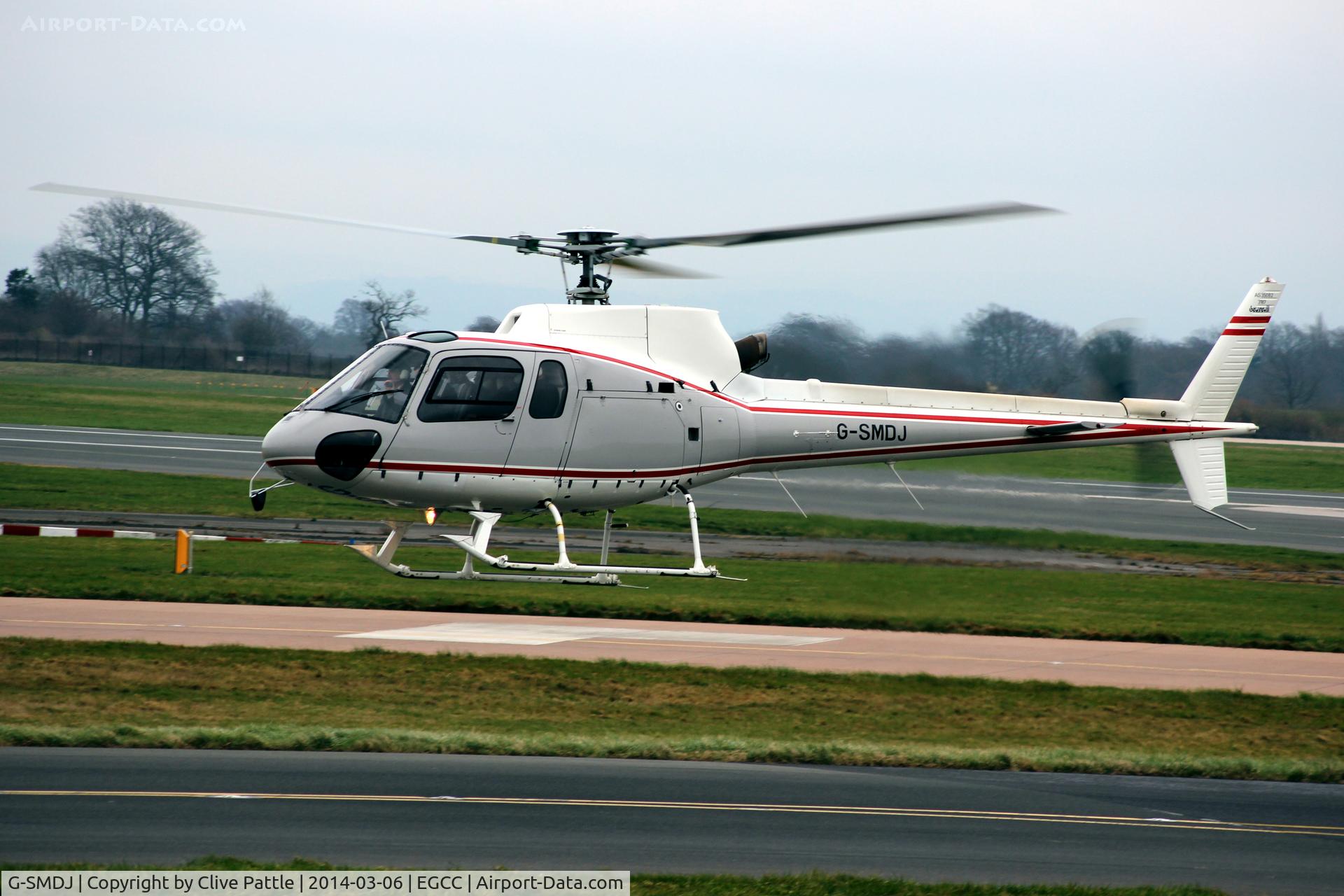 G-SMDJ, 1999 Eurocopter AS-350B-2 Ecureuil Ecureuil C/N 3187, EGCC Hover-taxi to the apron