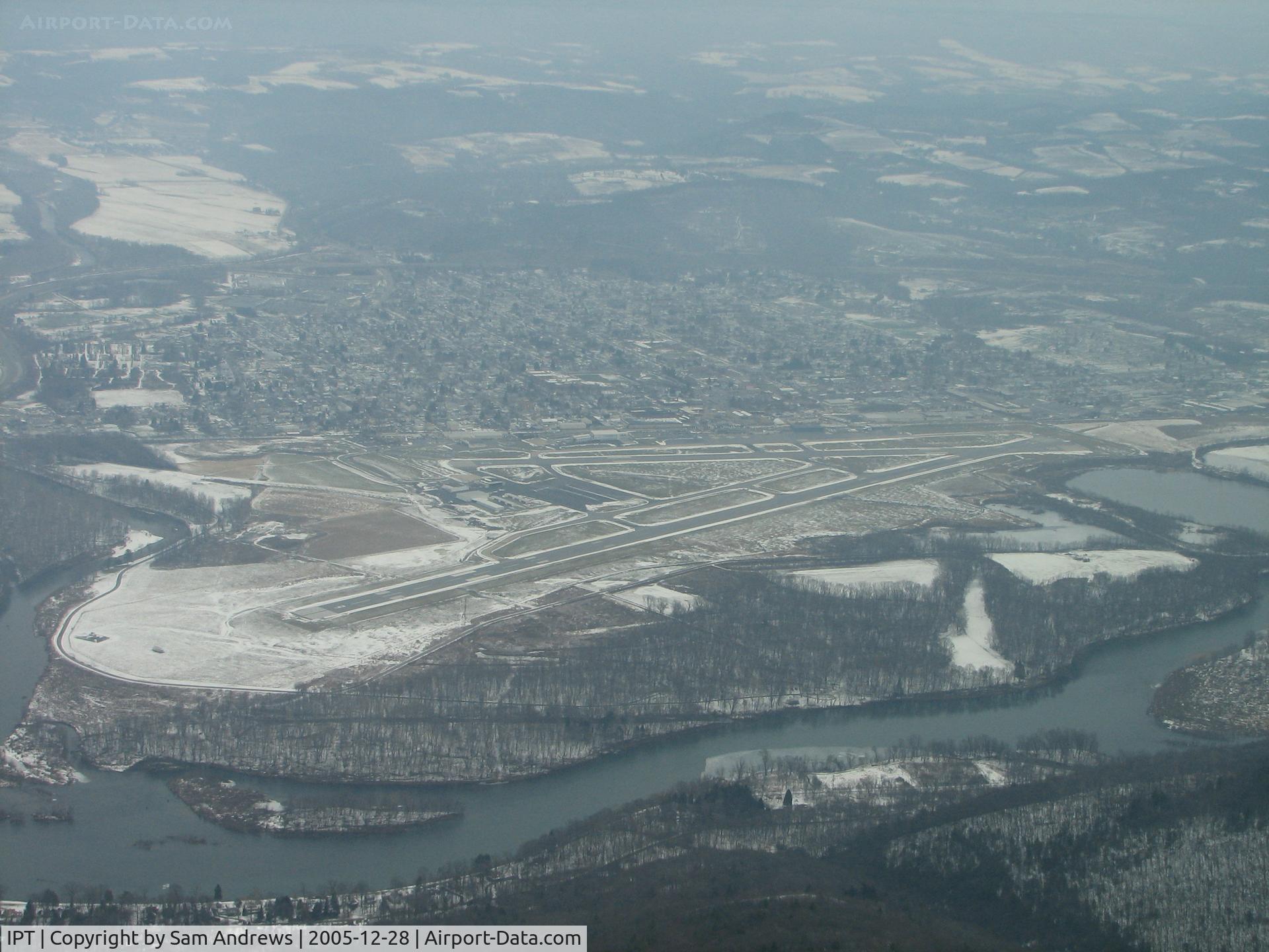 Williamsport Regional Airport (IPT) - Just over the ridge headed north to land RWY9.  The Susquehanna River can be seen on the south side of the airport.  If you look close you can see WalMarts Lear N78PR parked on the ramp.