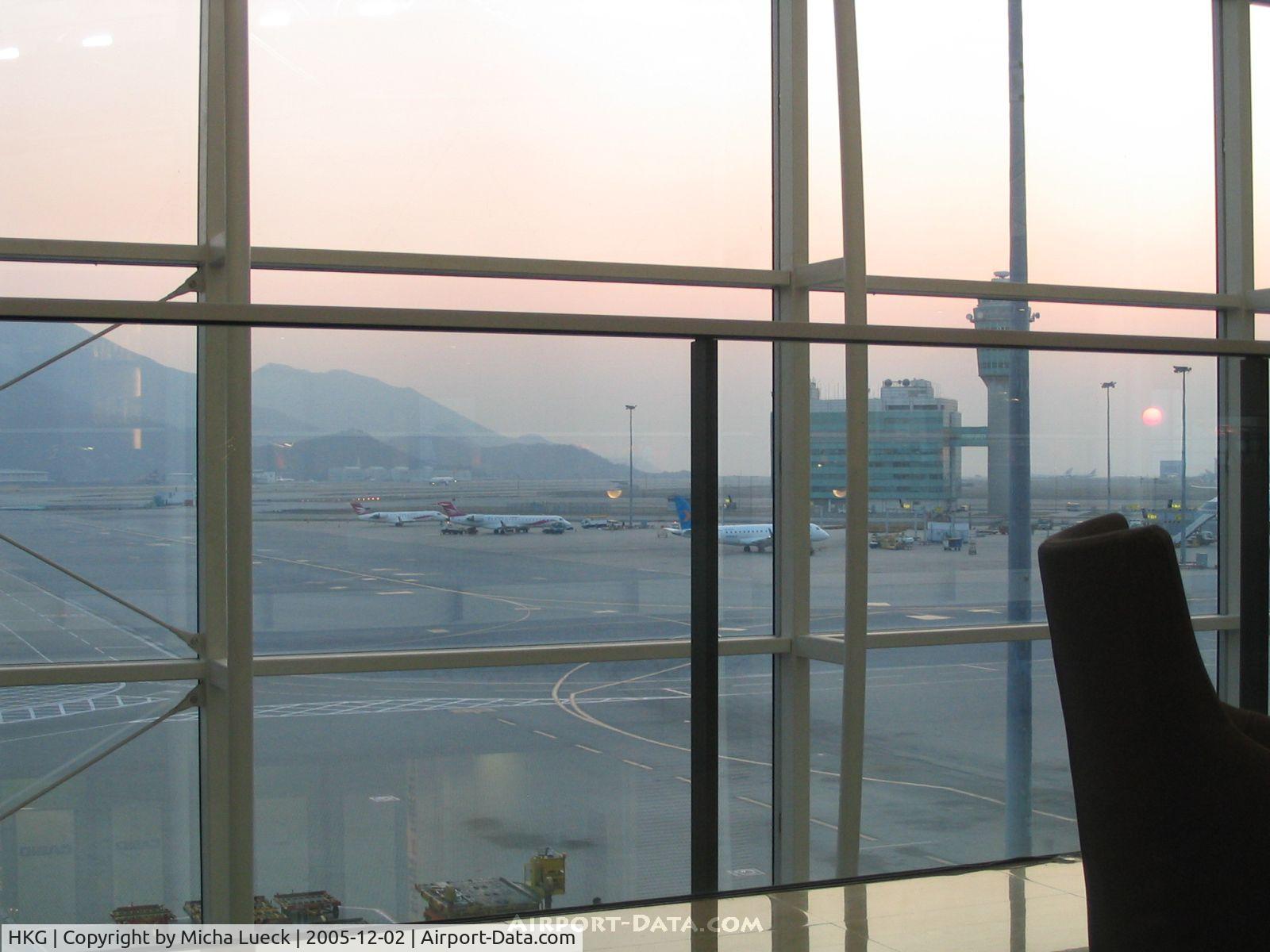 Hong Kong International Airport, Hong Kong Hong Kong (HKG) - Beautiful sunset at Chep Lap Kok. View from the UA Red Carpet Club onto the apron and runway