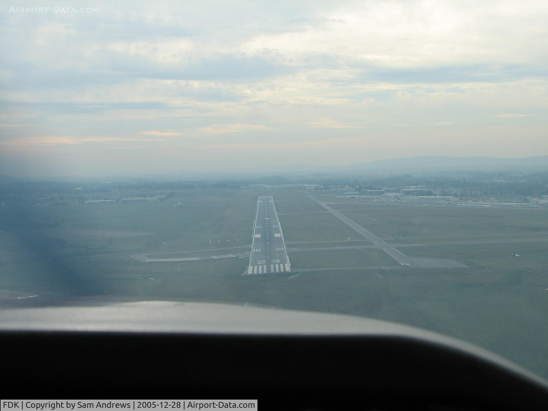 Frederick Municipal Airport (FDK) - On Final RWY 23 at FDK.  Count the planes on the airport.  1 on the Rwy and 4 on the taxi ways.  Taxiing in I noticed that the plane behind us had to leave the pattern for aircraft entering the runway.  This is a slow day at Maryland's 2nd busiest airport