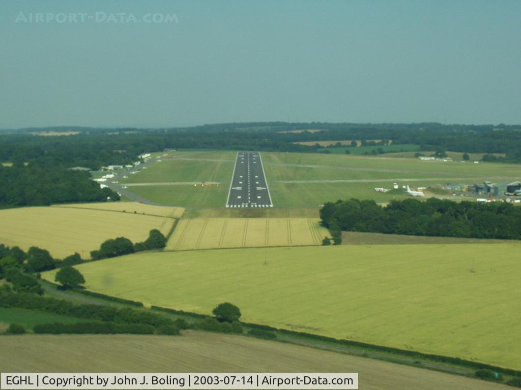 Lasham Airfield Airport, Basingstoke, England United Kingdom (EGHL) - Lasham England. Glider field. Large aircraft maint facility on sw corner of field (right side of photo) Capt Bruce Burns and Capt john Boling delivered two 757s for maint in 2003