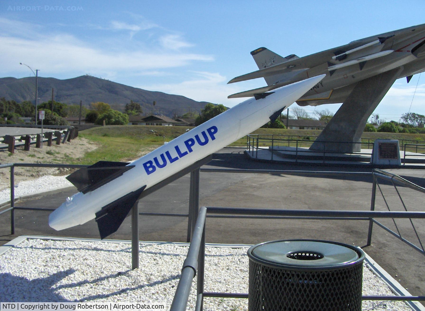 Point Mugu Nas (naval Base Ventura Co) Airport (NTD) - Missile Park-ASM-N-7/AGM-12 BULLPUP I, supersonic air to surface, range-3+ miles, TechEval 1956-1958. Mounted F-14A TOMCAT BuNo. 158623 in background