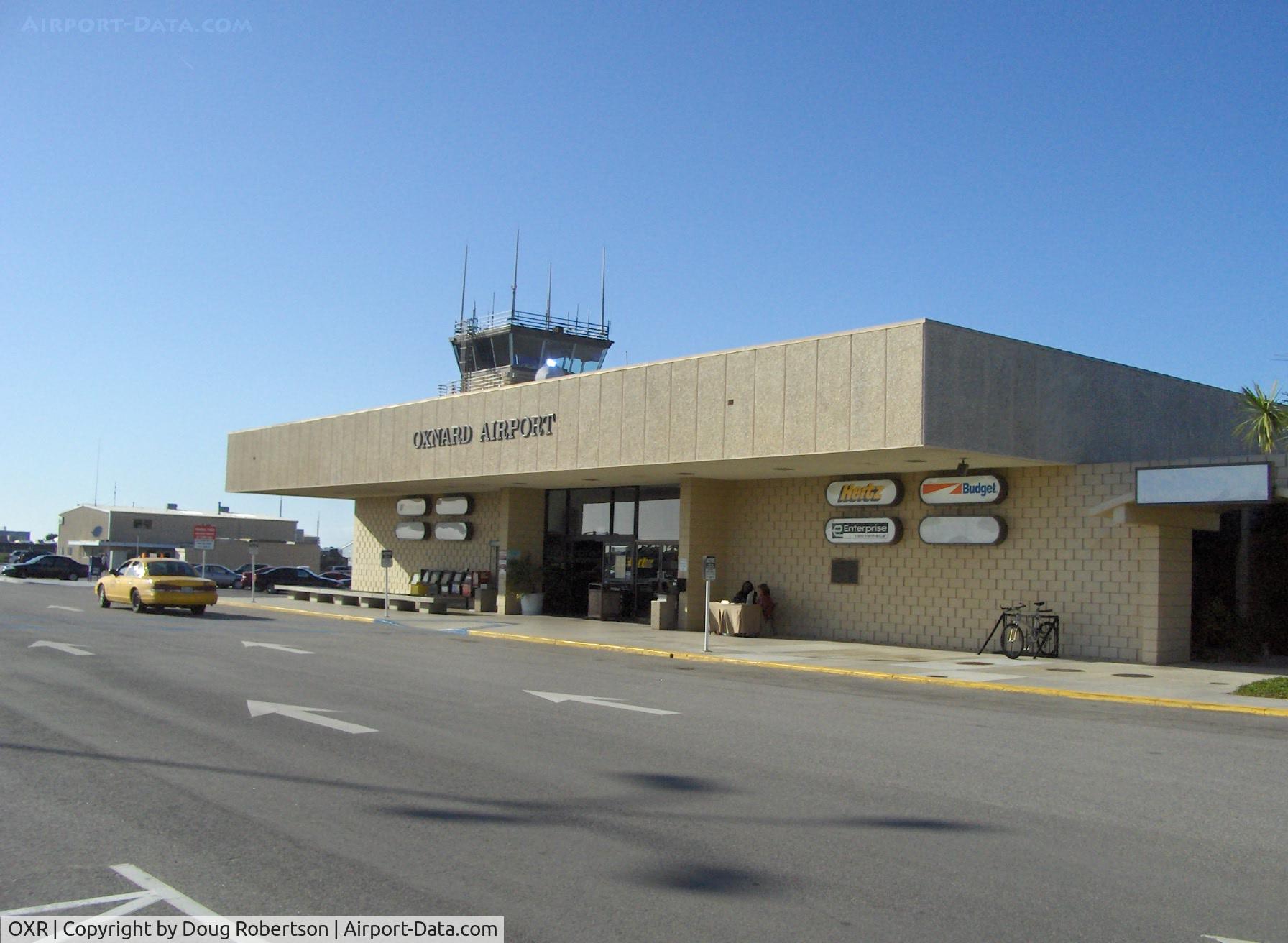 Oxnard Airport (OXR) - Oxnard, California Airport Passenger Terminal, FAA Tower beyond. Note: No commuter passenger service since Summer 2010.