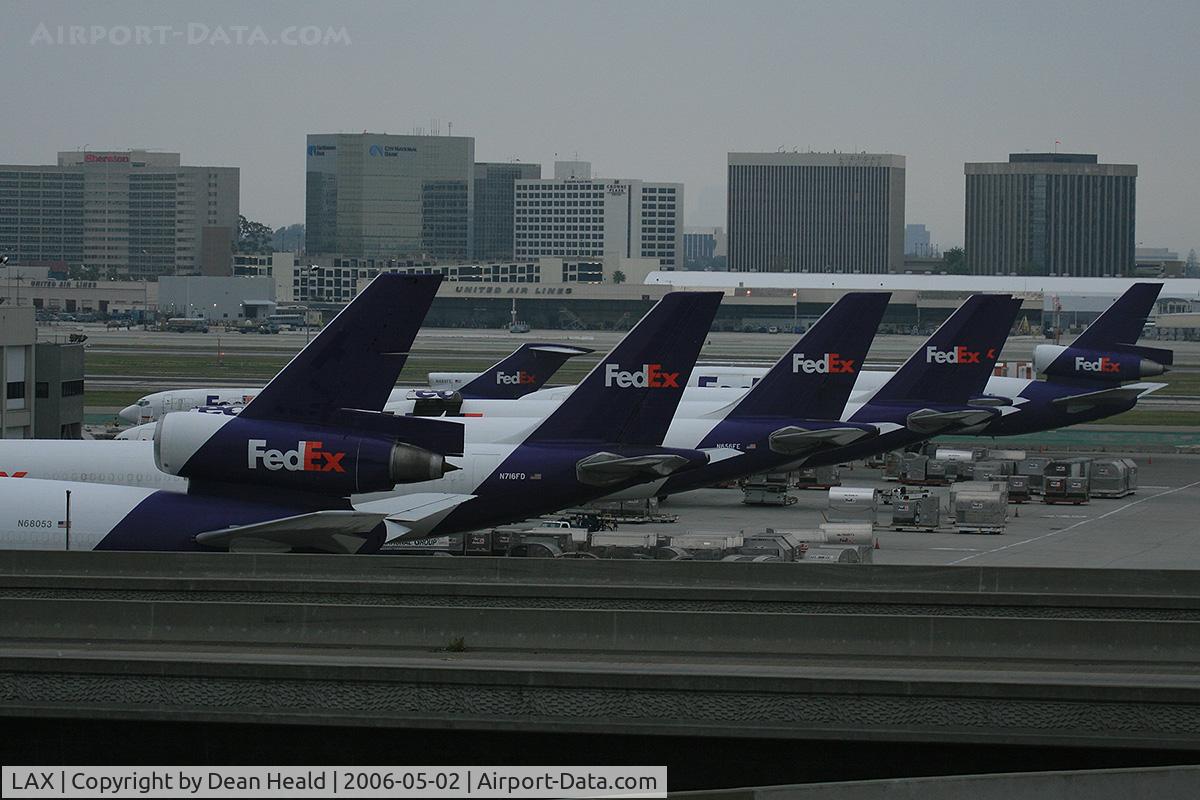 Los Angeles International Airport (LAX) - The FedEx terminal late in the evening at LAX is full. I count 7 aircraft just on this side. There are more to the right that are out of view.