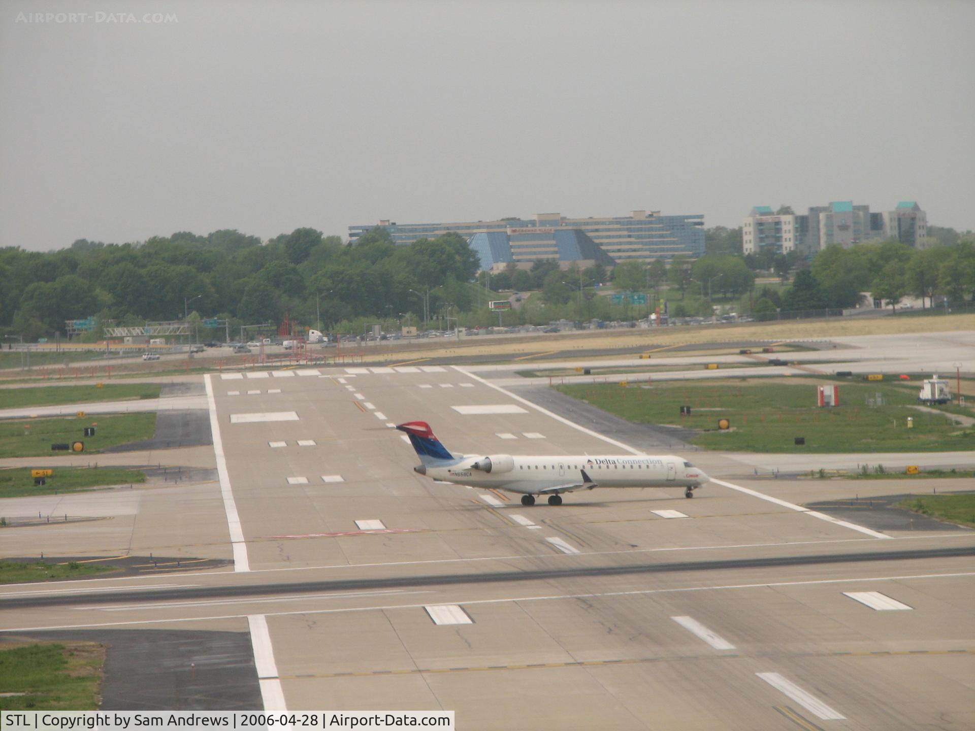 Lambert-st Louis International Airport (STL) - Taxiing to the terminal shot this bombardier crossing RWY6
