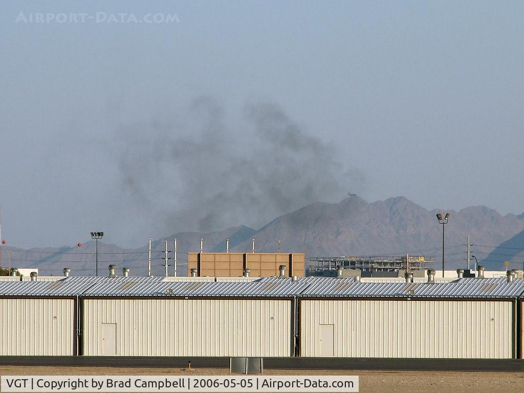 North Las Vegas Airport (VGT) - I was shooting at VGT & looked towards the taxi area to see if anything new was coming up. This is what I saw. My house is located in that direction and I almost went home. But hey, there is an airplane in the shot!
