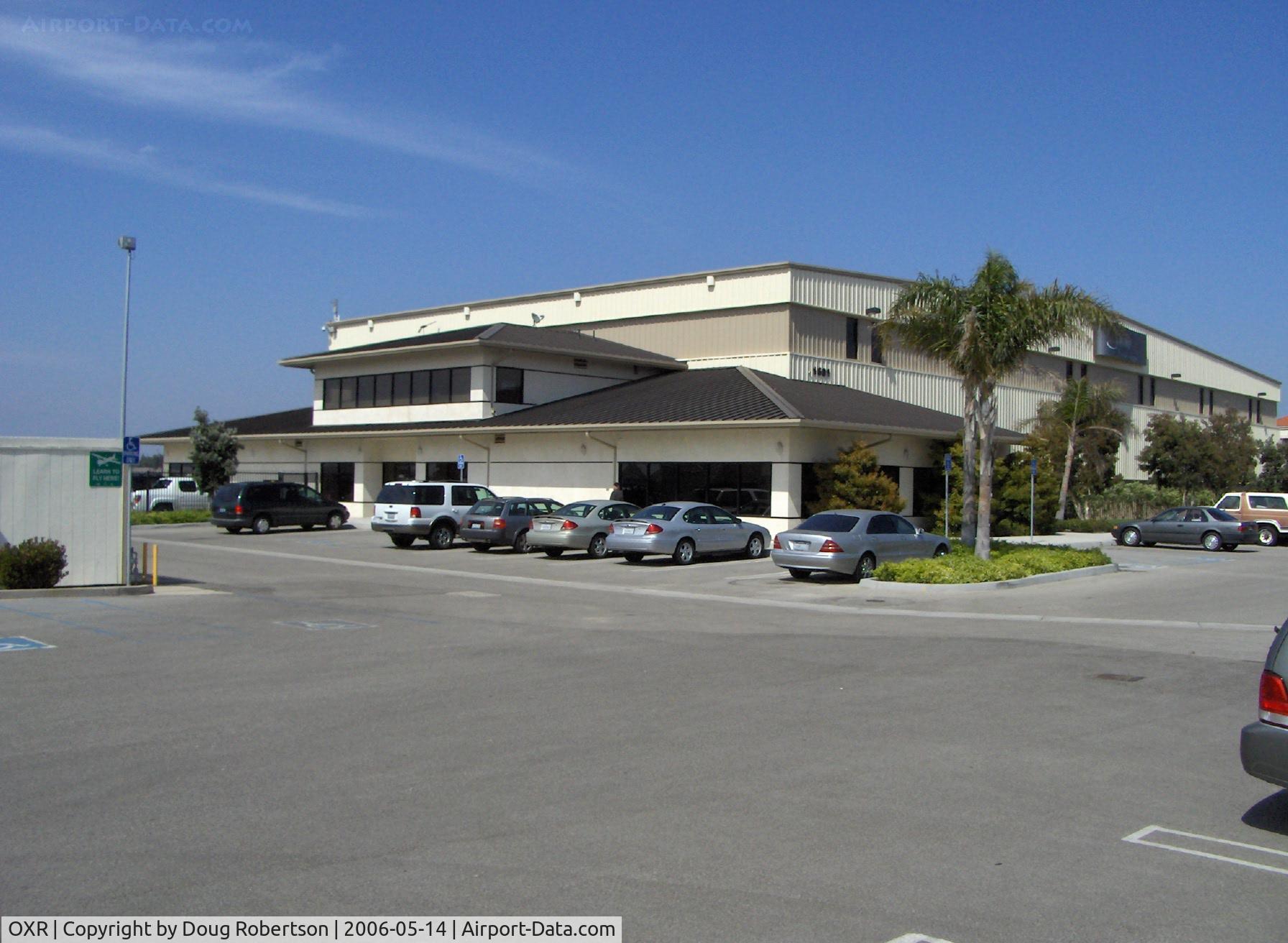Oxnard Airport (OXR) - Million Air FBO office and maintenance hangar, built on site of former Valenti Aviation Cessna dealer hangar that burned to the ground with total loss, aircraft & building