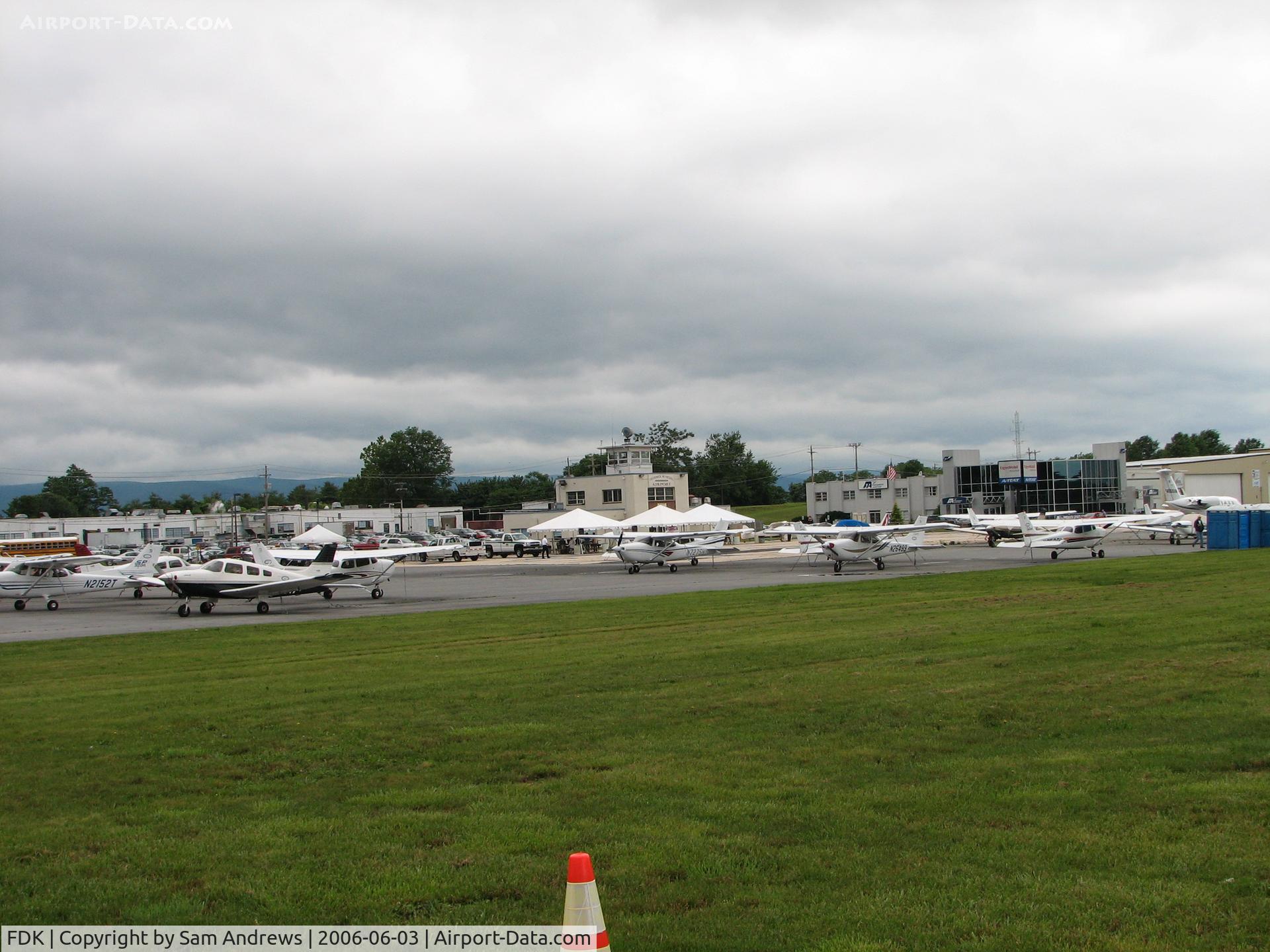 Frederick Municipal Airport (FDK) - This is the Frederick Flight Center ramp.  On any other day there would not be the white tents in front of the old tower, but this was AOPA Fly-in day.