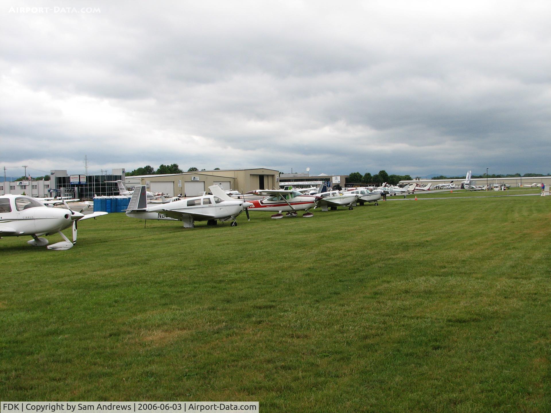 Frederick Municipal Airport (FDK) - Another view of the transcient flight line on AOPA Fly-in day.  The guys and gals in the red vests were giving out some dandy service directing traffic