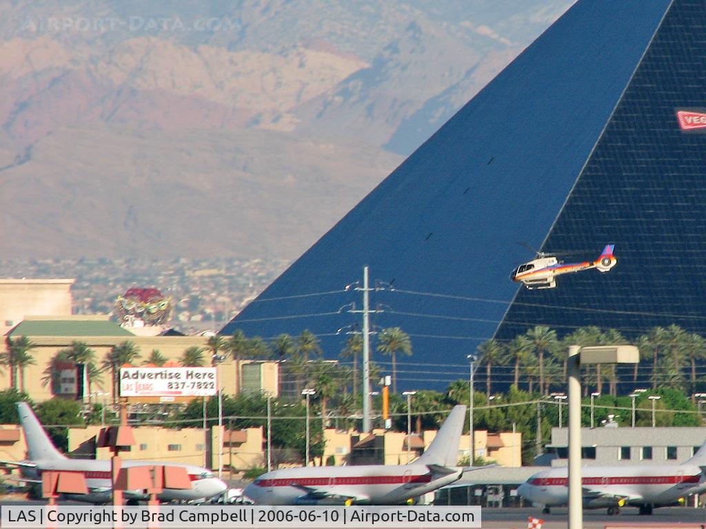 Harry Reid International Airport (LAS) - One of the many 'Tour' Helicopter flying past the Luxor and the Janet Ramp.