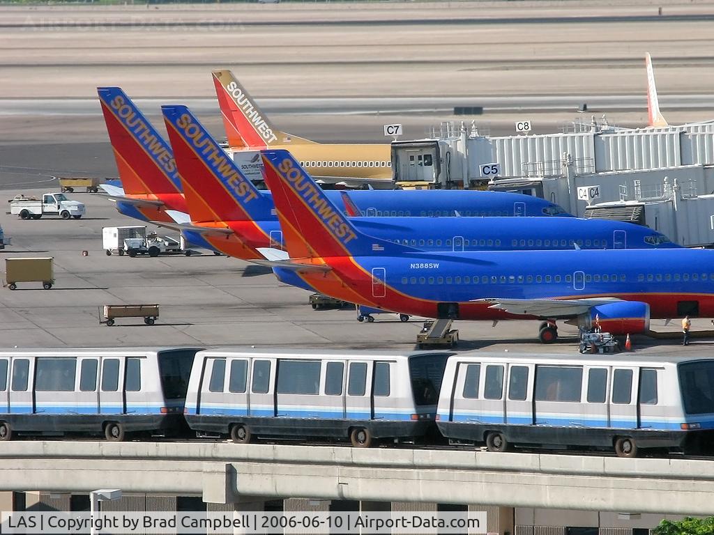 Harry Reid International Airport (LAS) - The 'C' Gates where Southwest Airlines docks. One of the Trams in foreground headed to 'D' Gates