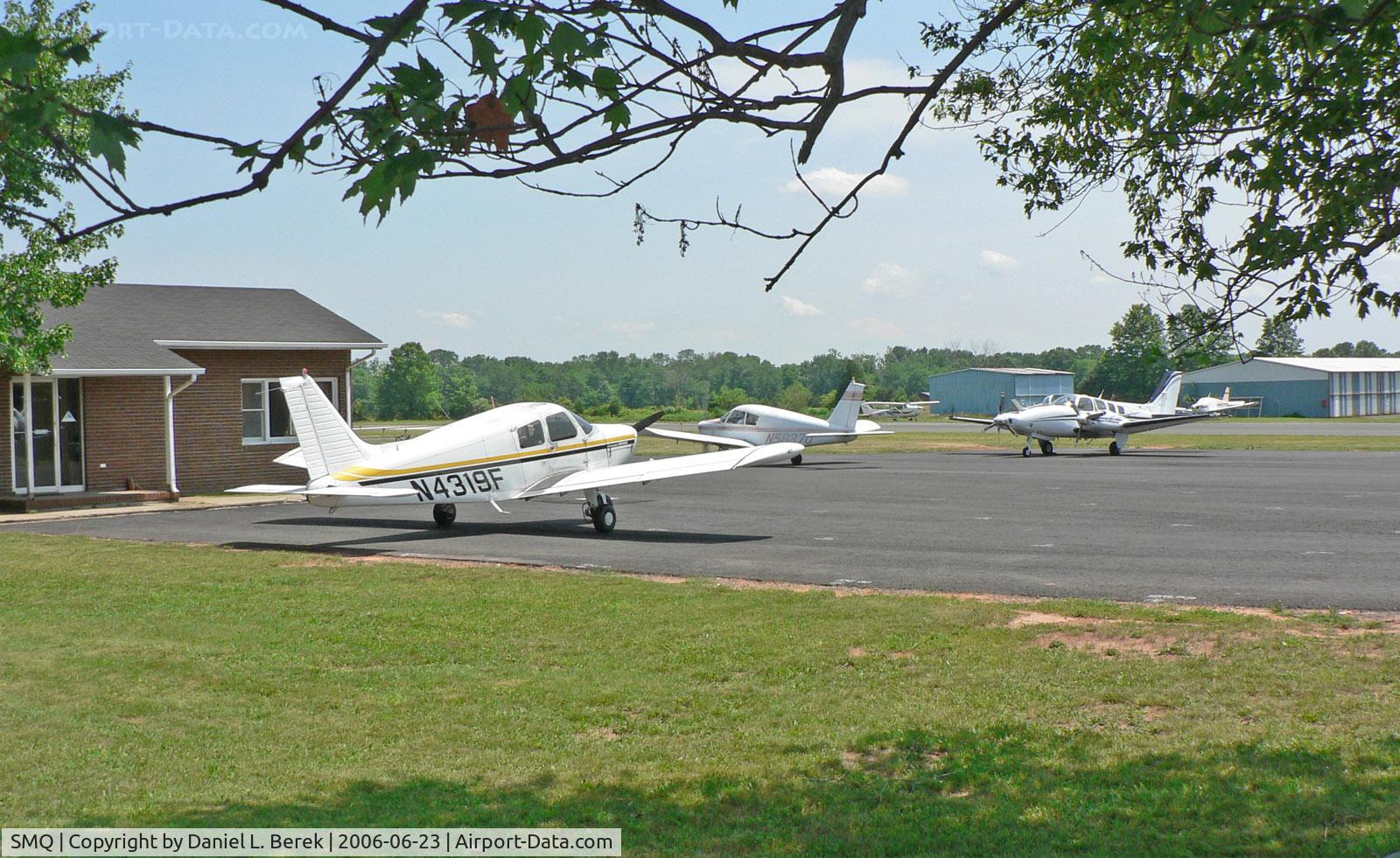 Somerset Airport (SMQ) - The pilot shop is located between the two runways; in the background are additional maintenance facilities.
