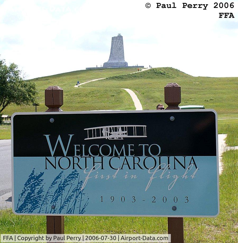 First Flight Airport (FFA) - The welcome sign at FFA, with the Wright Brother's Memorial in the background