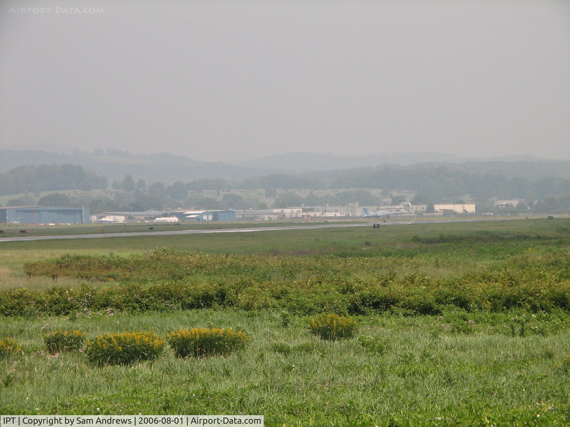 Williamsport Regional Airport (IPT) - Looking across the airport grounds from west to east.  Look closely and you can see a B-17 taxiing out for takeoff.