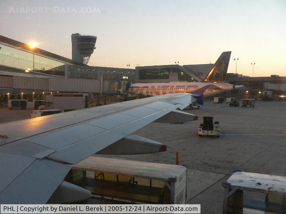 Philadelphia International Airport (PHL) - Here is the control tower and main terminal, as seen from an Air Jamaica A320 at dawn.