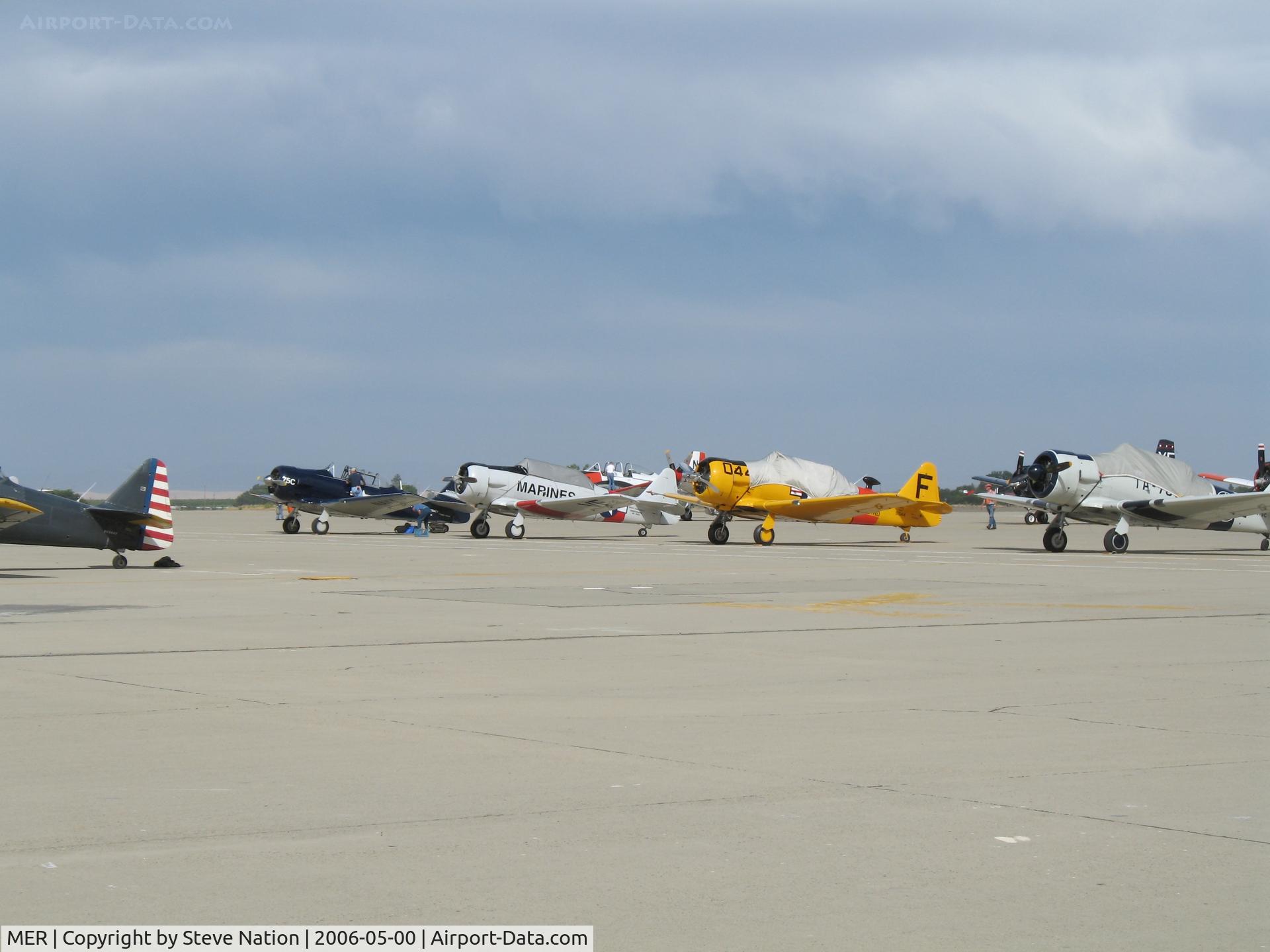 Castle Airport (MER) - T-6/SNJ flight-line (T-28s in background) at 2006 West Coast Formation Clinic held on expansive old SAC ramp @ Castle AFB