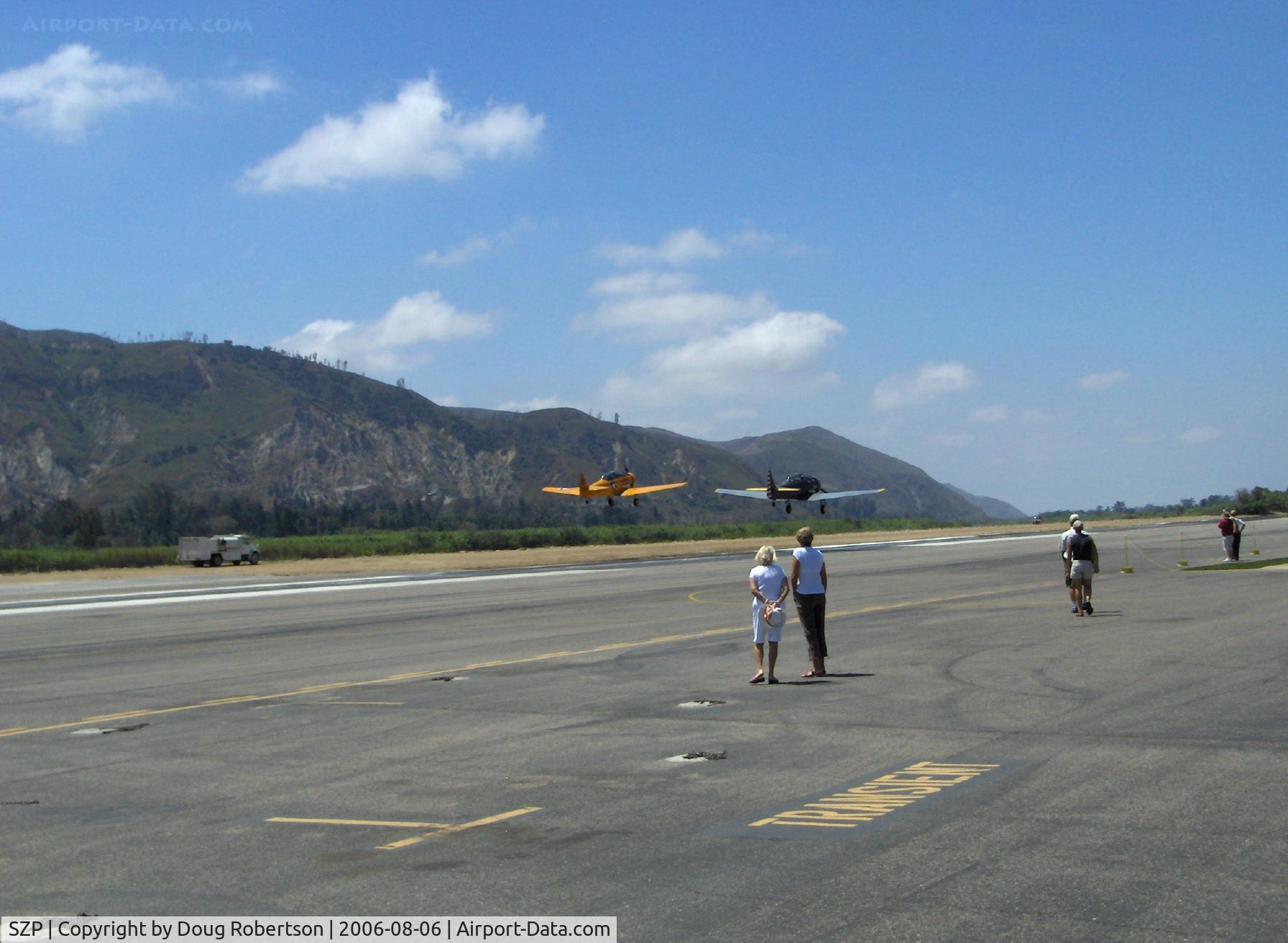 Santa Paula Airport (SZP) - Tandem liftoff N89014 SNJ-5 & N8540P AT-6D, Runway 22, (just 60' wide)