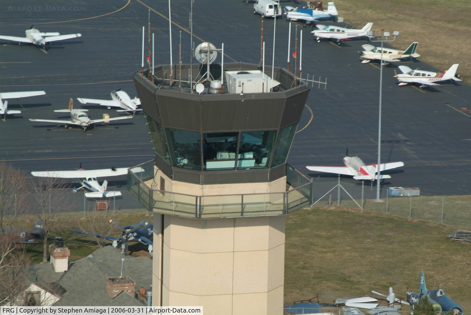 Republic Airport (FRG) - A close flyby of the tower approaching the Bravo runup area....