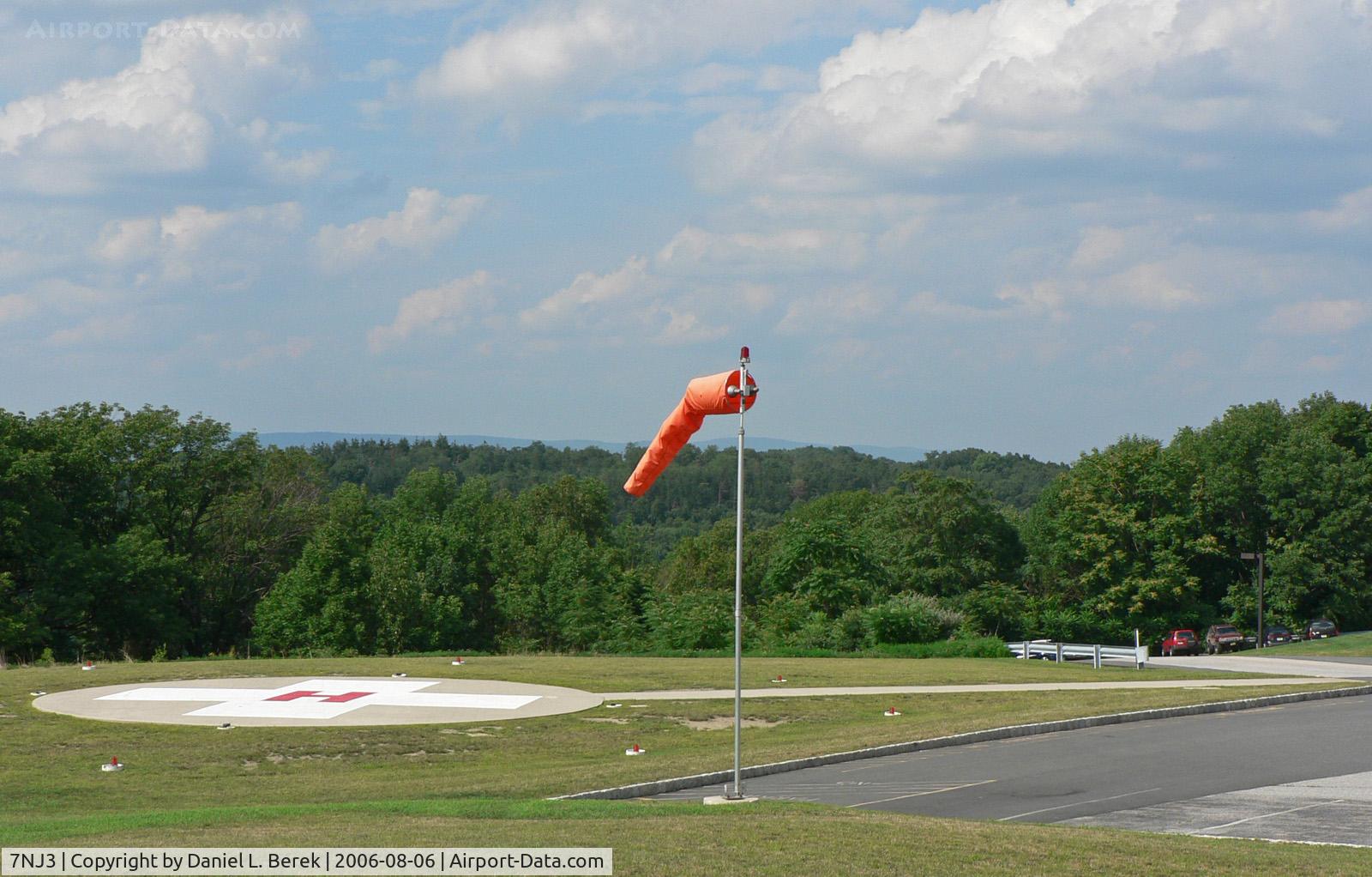 Newton Memorial Hospital Heliport (7NJ3) - Newton's emergency medical helipad overlooks the forested hilsides of Sussex County.