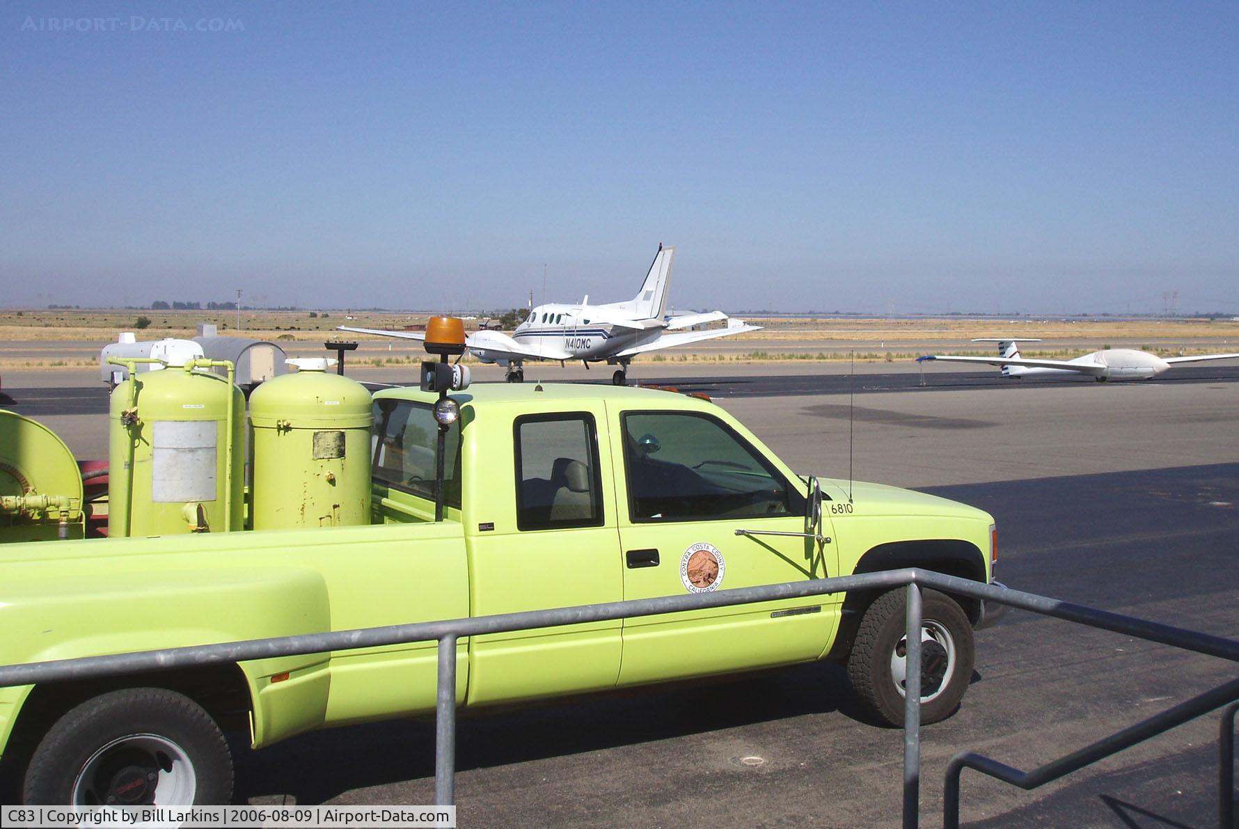 Byron Airport (C83) - Airport truck and visiting plane