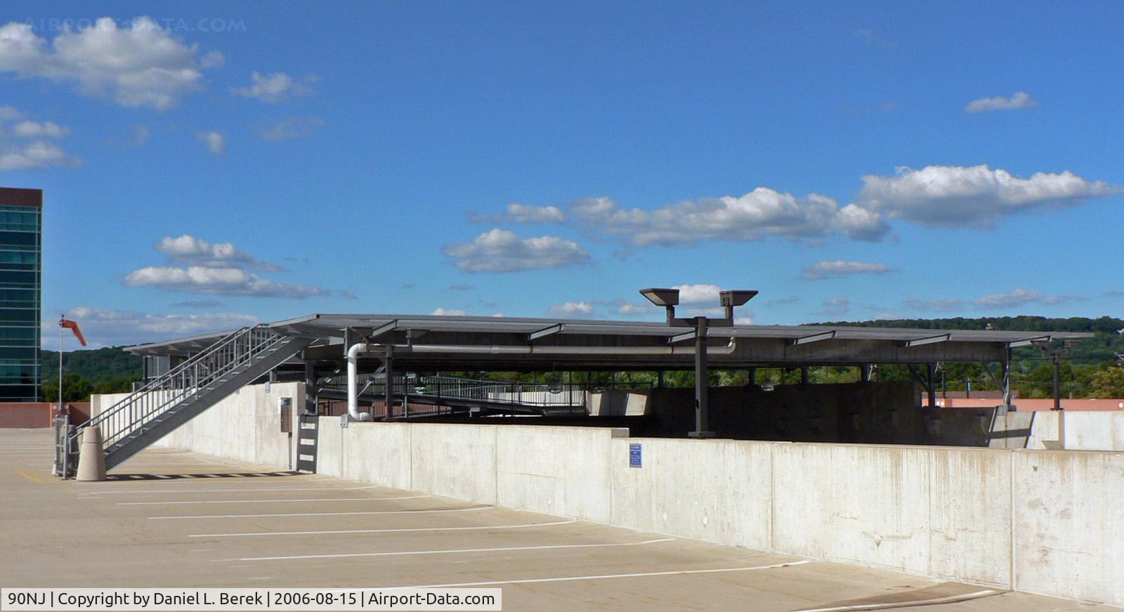 Bridgewater Crossing Heliport (90NJ) - Bridgewater Crossing is a large office complex in central New Jersey. The helipad is located atop one of the parking garages; the ramp in the back provides wheelchair access.