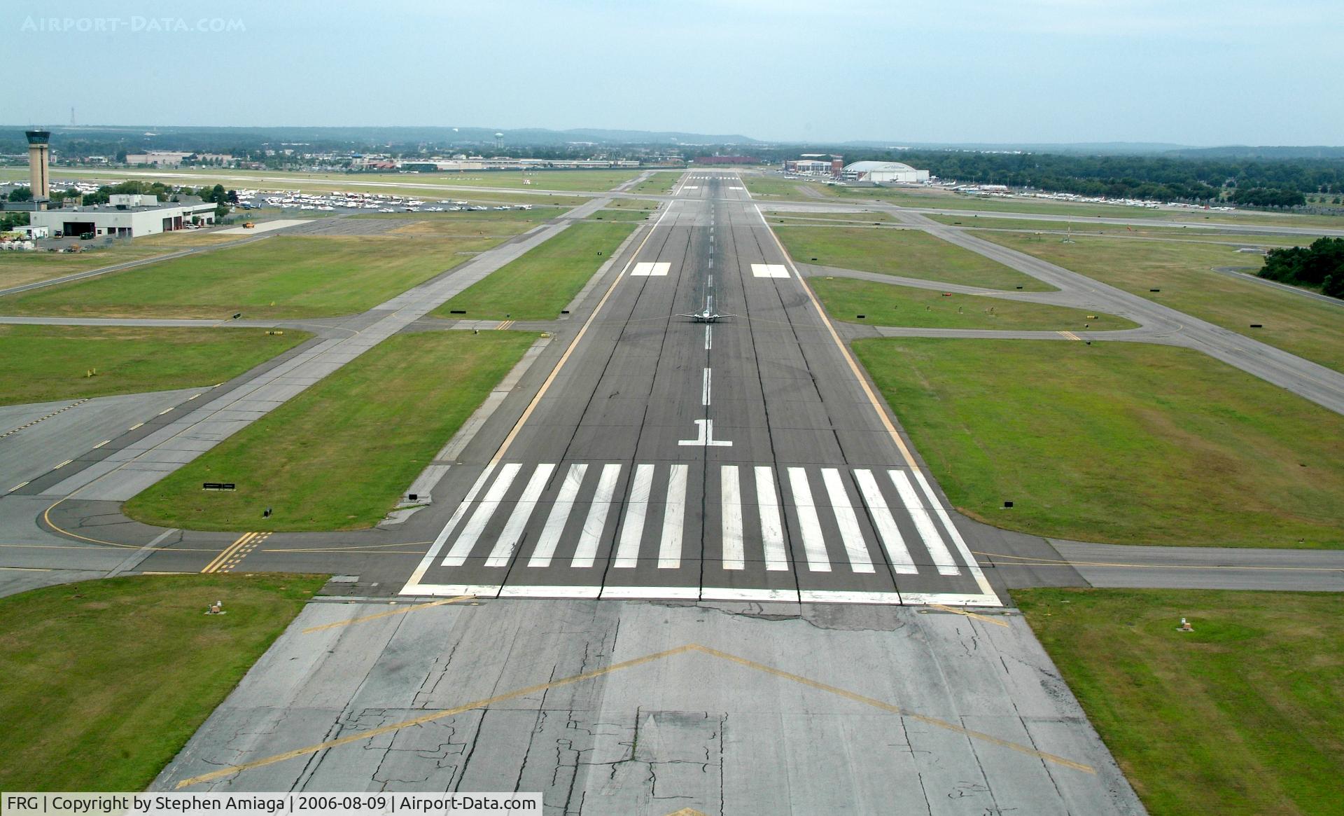 Republic Airport (FRG) - Departing across RWY 1 (Helo) with a Baron Rolling out 19