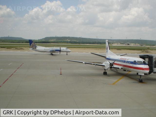 Robert Gray Aaf Airport (GRK) - A Colgan Air Saab 340 taxies to the runway for a flight to IAH, while a American Eagle Saab 340 is parked at the gate after a flight from DFW