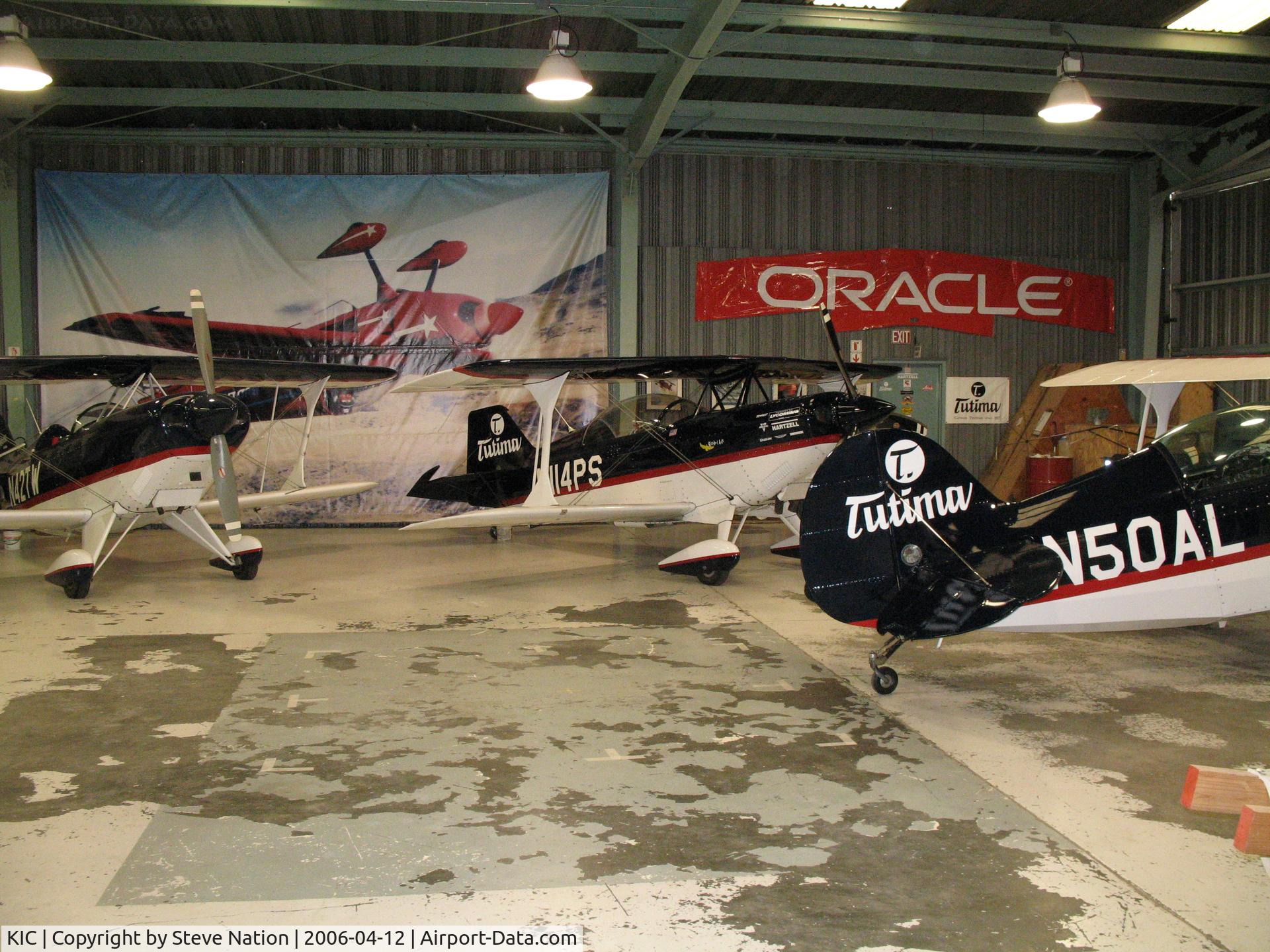 Mesa Del Rey Airport (KIC) - Sean D. Tucker School of Aerobatic Flight hangar with Pitts S-2Bs N42TW and N50AL and S-2C N114PS visible (Mesa Del Rey Airport, King City, CA)