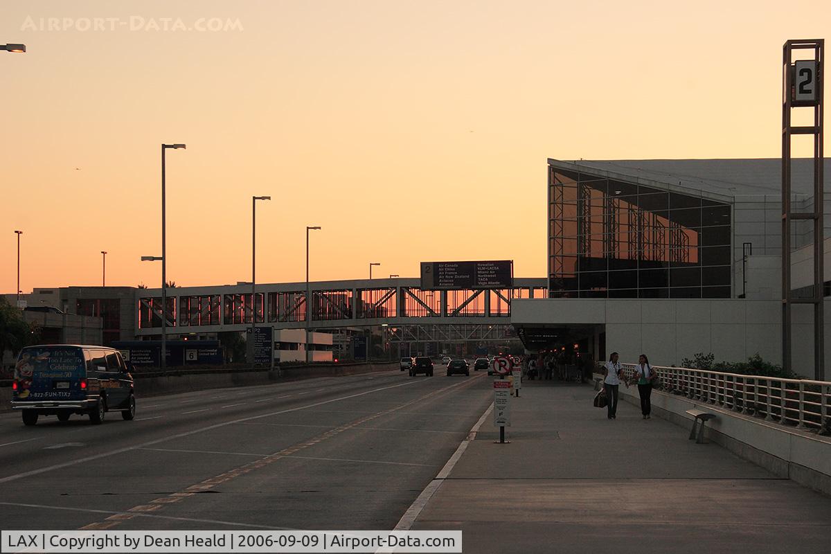 Los Angeles International Airport (LAX) - On the Arrival Level west of Terminal 1 looking west toward Terminal 2 just prior to sunset.